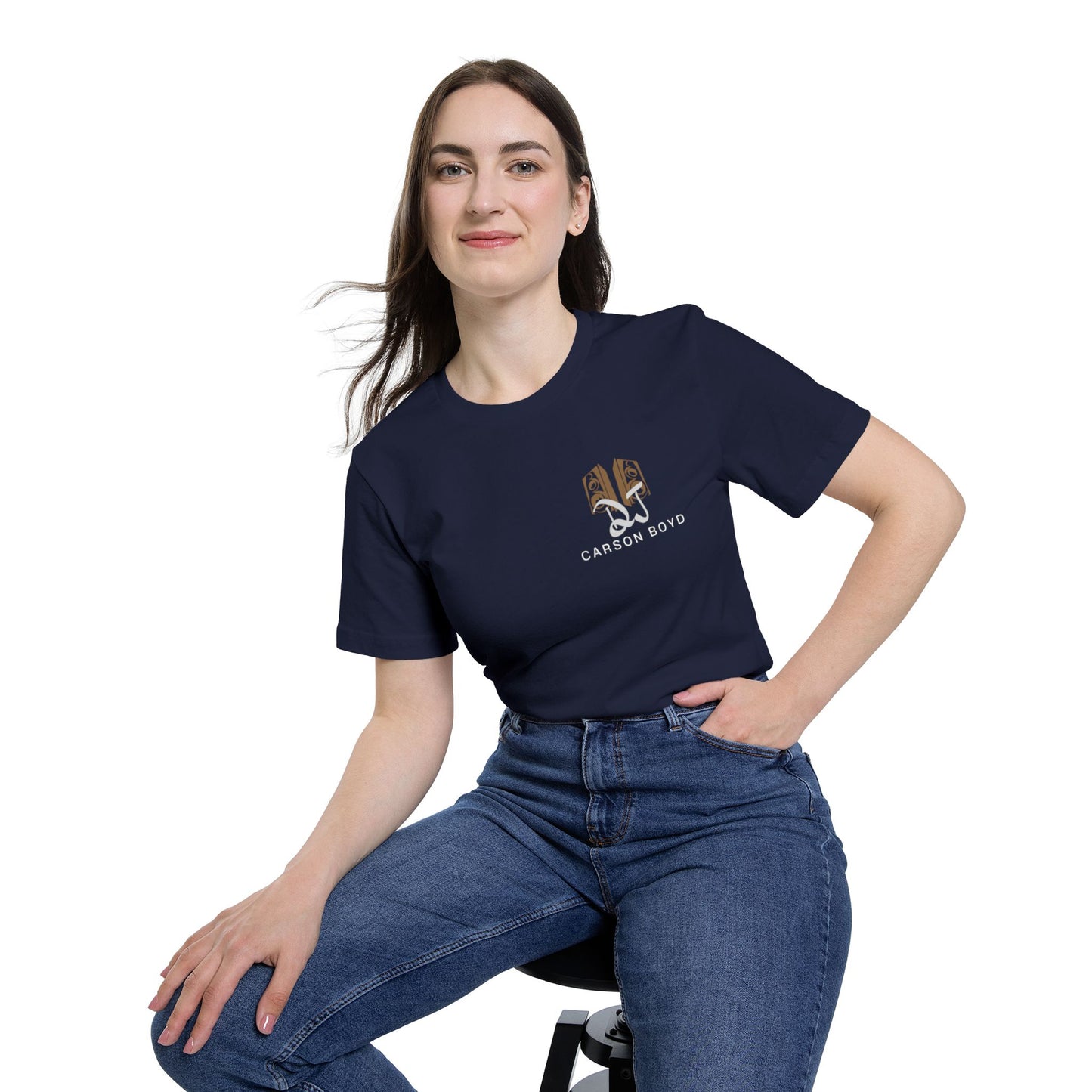 Female model lounging in navy crew t-shirt with subtle DJ Carson Boyd logo on chest—cool, confident vibes