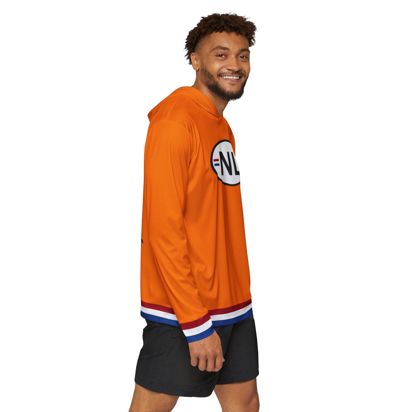 Right side view of grinning model rocking orange NL hoodie, partial badge visible with striped cuffs and black shorts