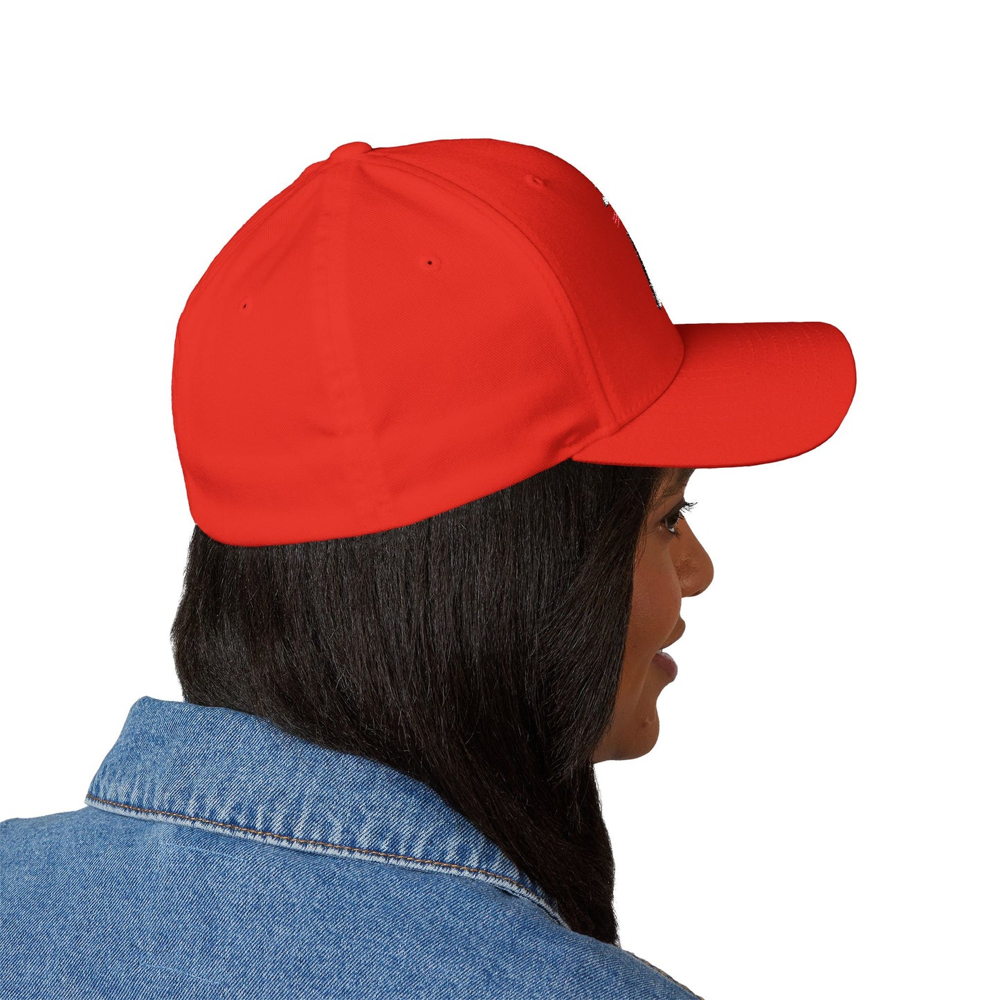 Side view of model wearing red embroidered "Stand With ICE" cap, visor curved just right