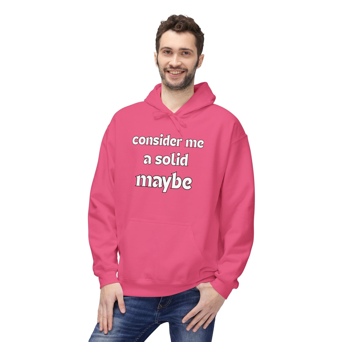 Grinning guy in pink hoodie printed "Consider Me A Solid Maybe," front view with hands in kangaroo pocket
