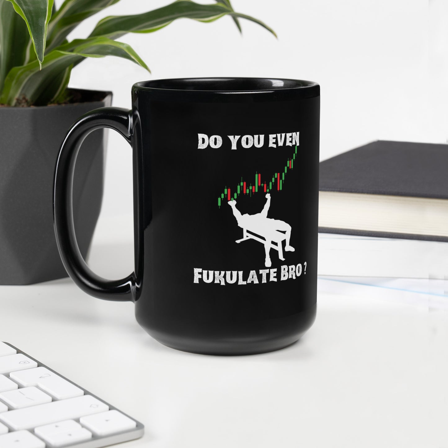 Cozy setup: black trading meme mug by plant, stacked books, keyboard—fuel for those charts