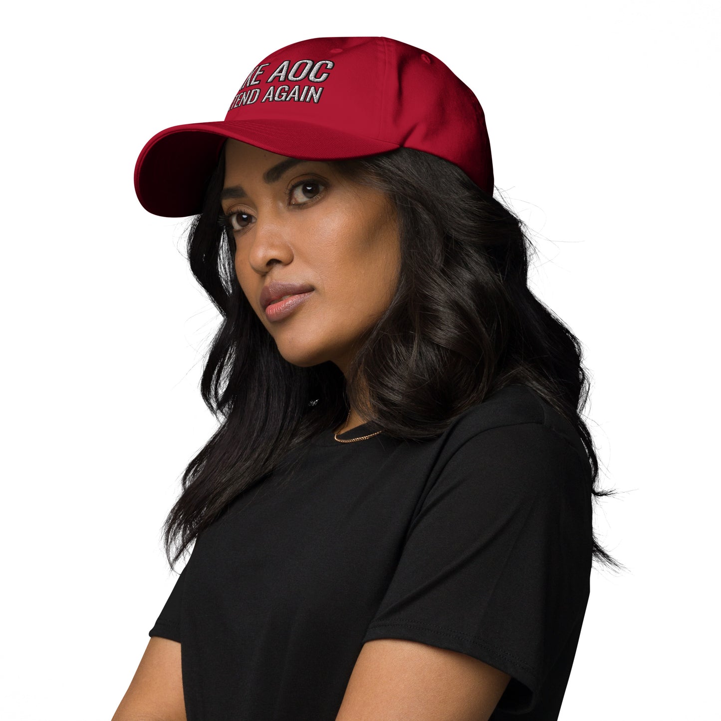 Model's left side profile in red dad hat showing "Make AOC" embroidery, black tee, wavy hair