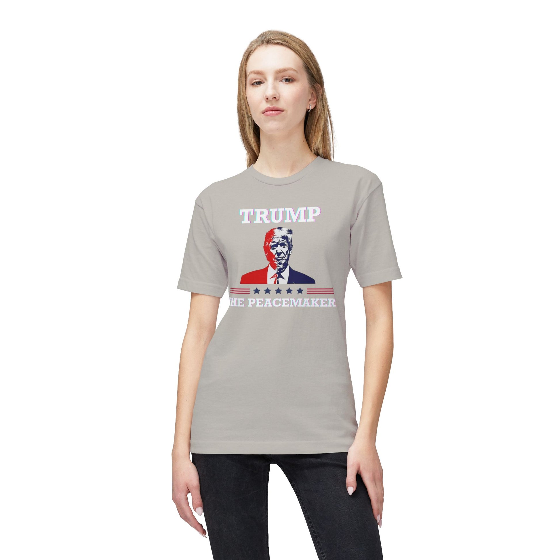 Model shows front of heather gray tee: white "TRUMP" over colorful Trump image, "HE ★ PEACEMAKER" — meme magic