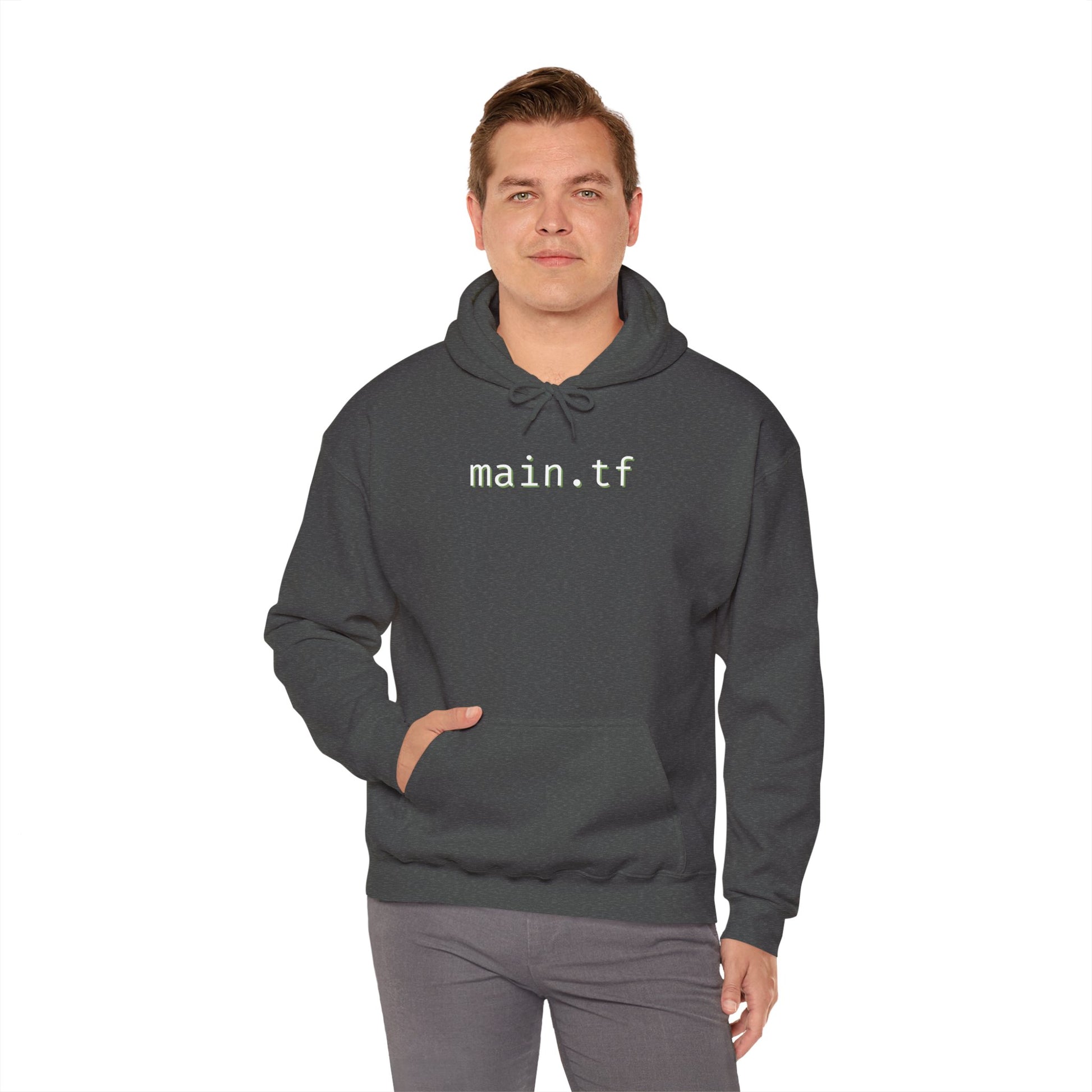 Man wearing dark heather gray "main.tf" hoodie front view, light cyan monospace text, gray pants