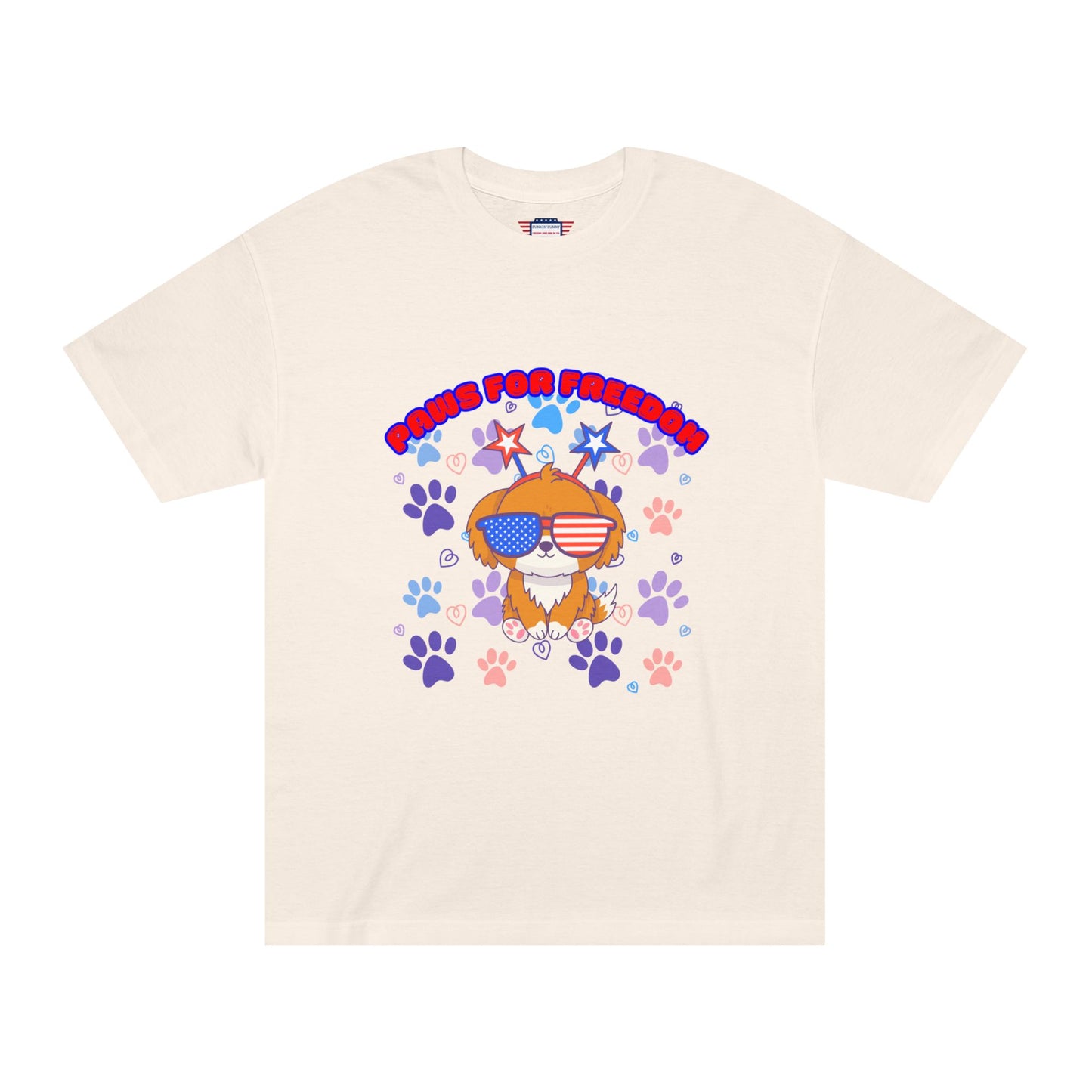 Cream 'Paws for Freedom' tee front flat lay, Gildan label, orange dog rocking flag sunnies & colorful accents