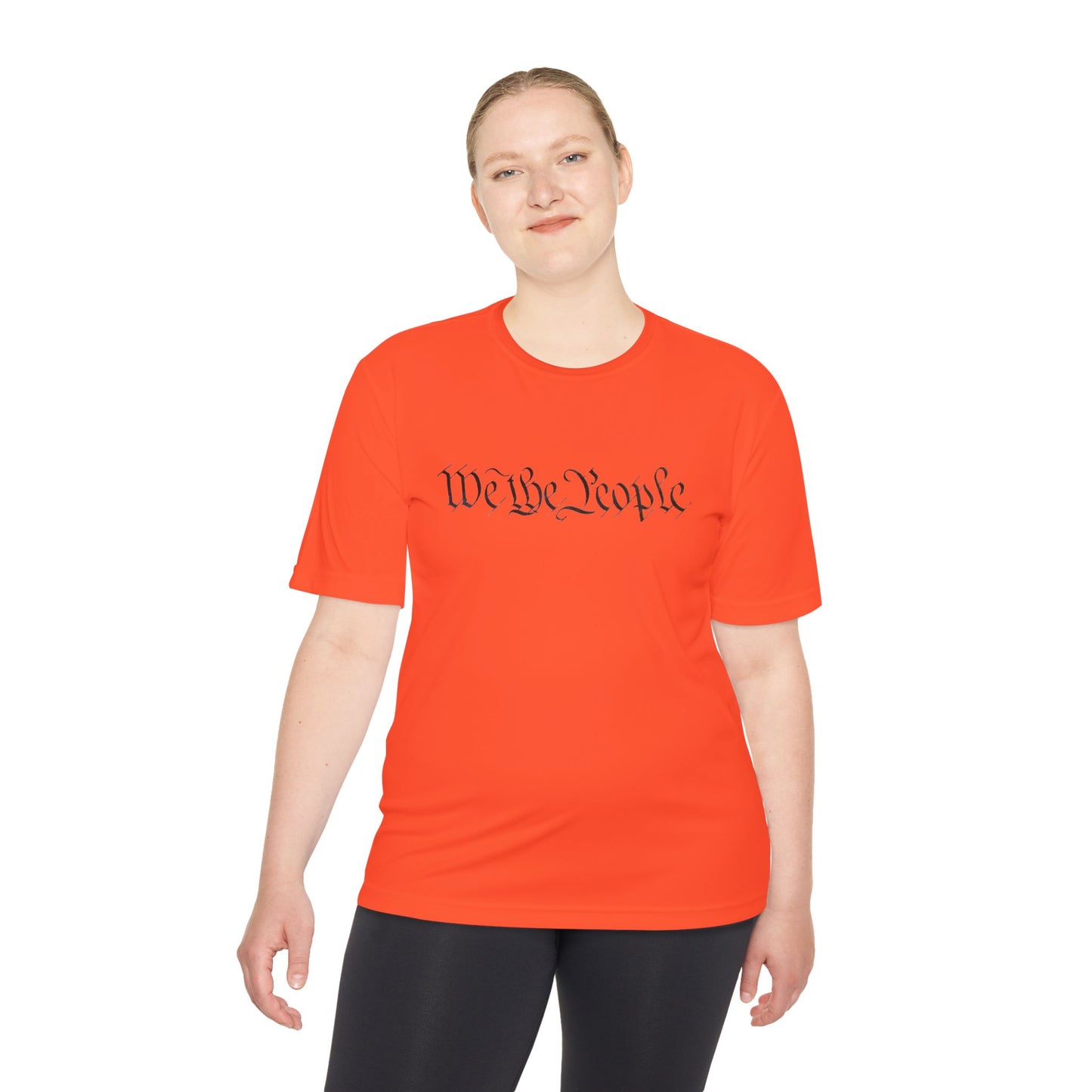Female model in bright orange moisture-wicking tee featuring dark "We the People" script