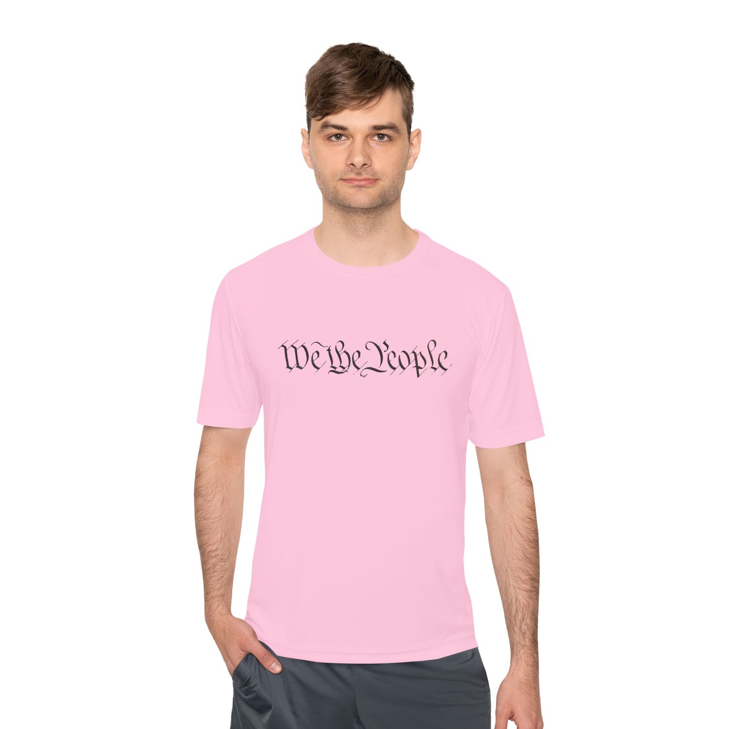 Male model front view rocking hot pink tee, bold black cursive "We the People" print