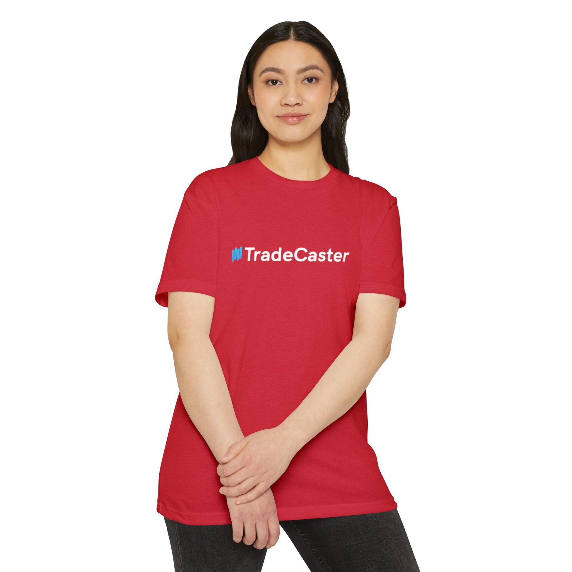 Woman modeling front view of bright red unisex TradeCaster jersey t-shirt with blue logo on chest, casual stance