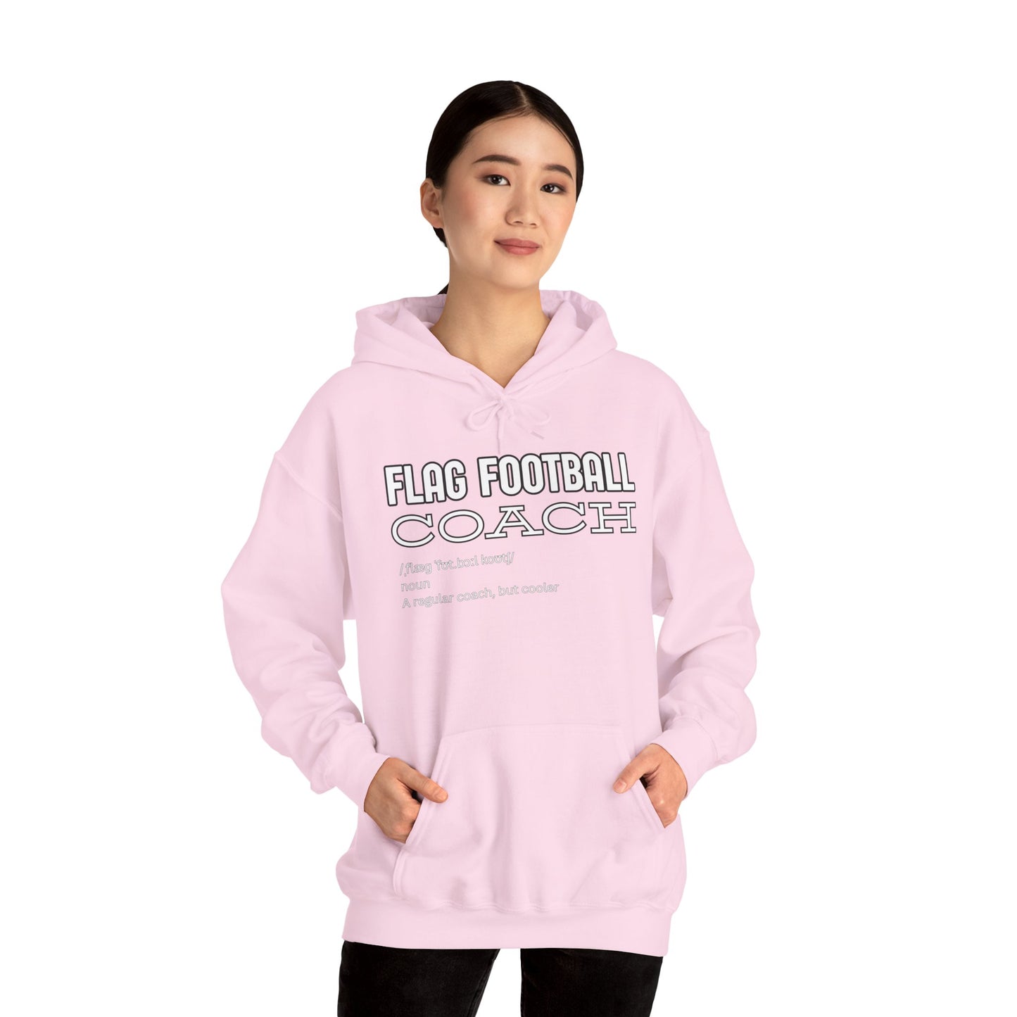 Asian female model in light pink "Flag Football Coach" hoodie front view, hands casually in pockets