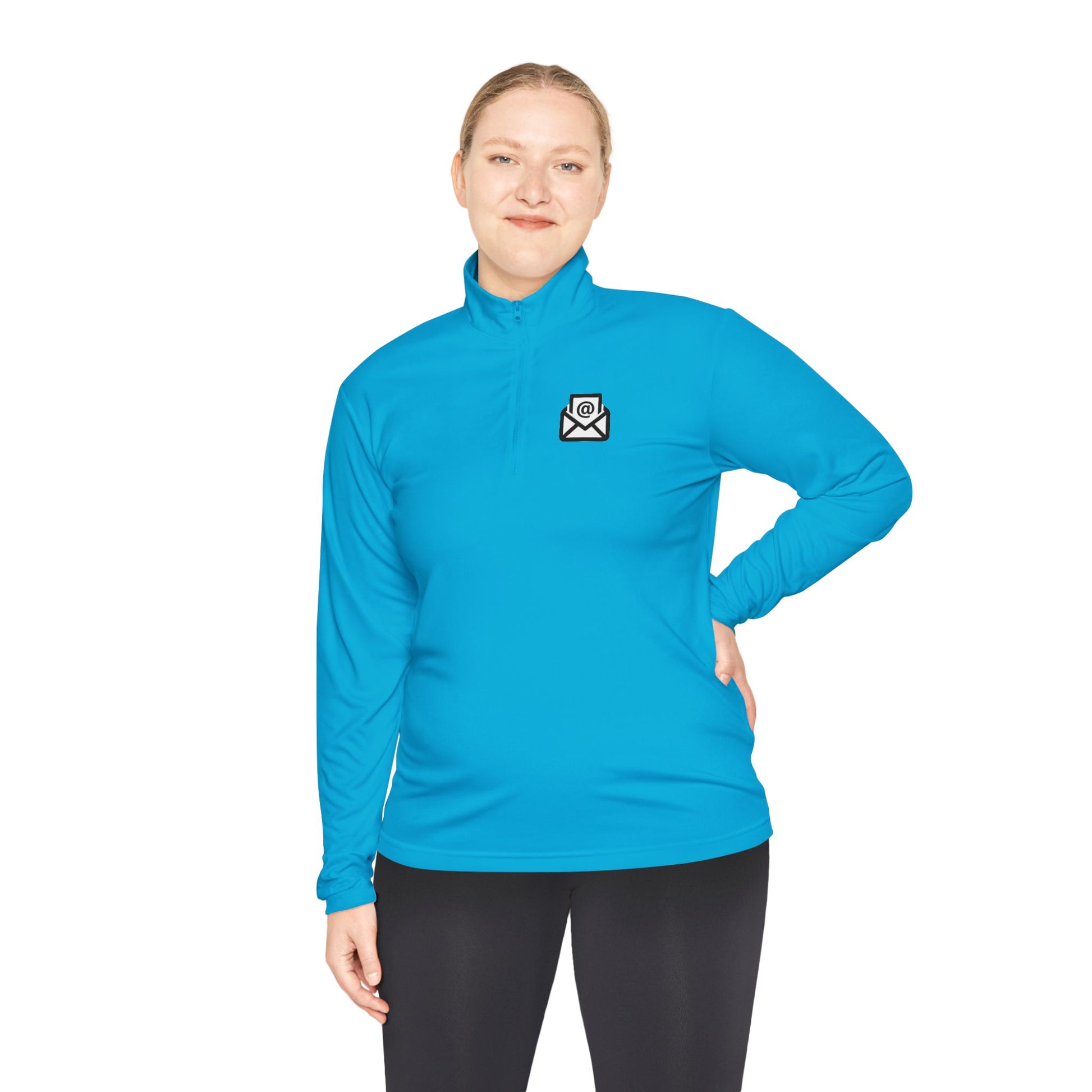 Woman wearing bright cyan quarter-zip pullover front, subtle white envelope patch on chest, black pants