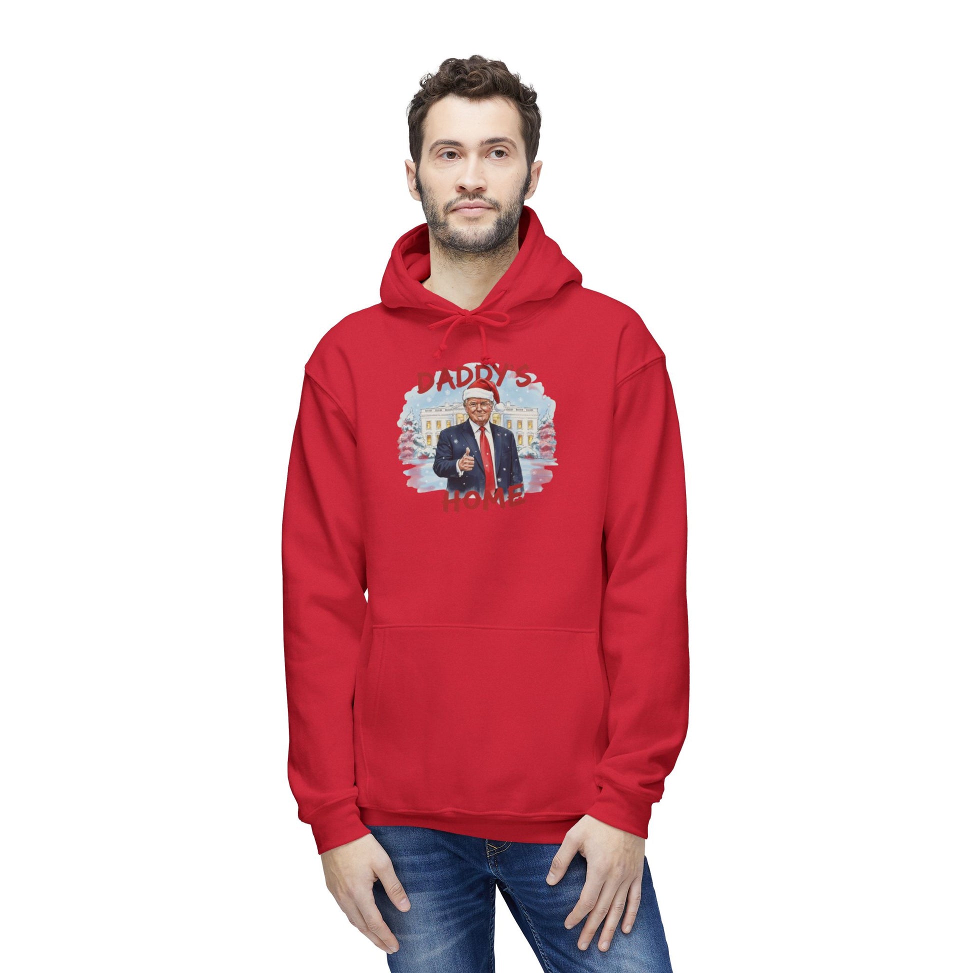 Male model front view in red "Daddy's Home" Trump Santa hoodie with snowy White House graphic, casual jeans