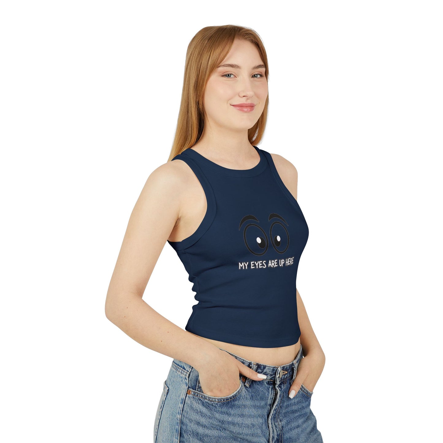 Side view of model in navy crop racerback tank flaunting cartoon eyes "My Eyes Are Up Here" graphic