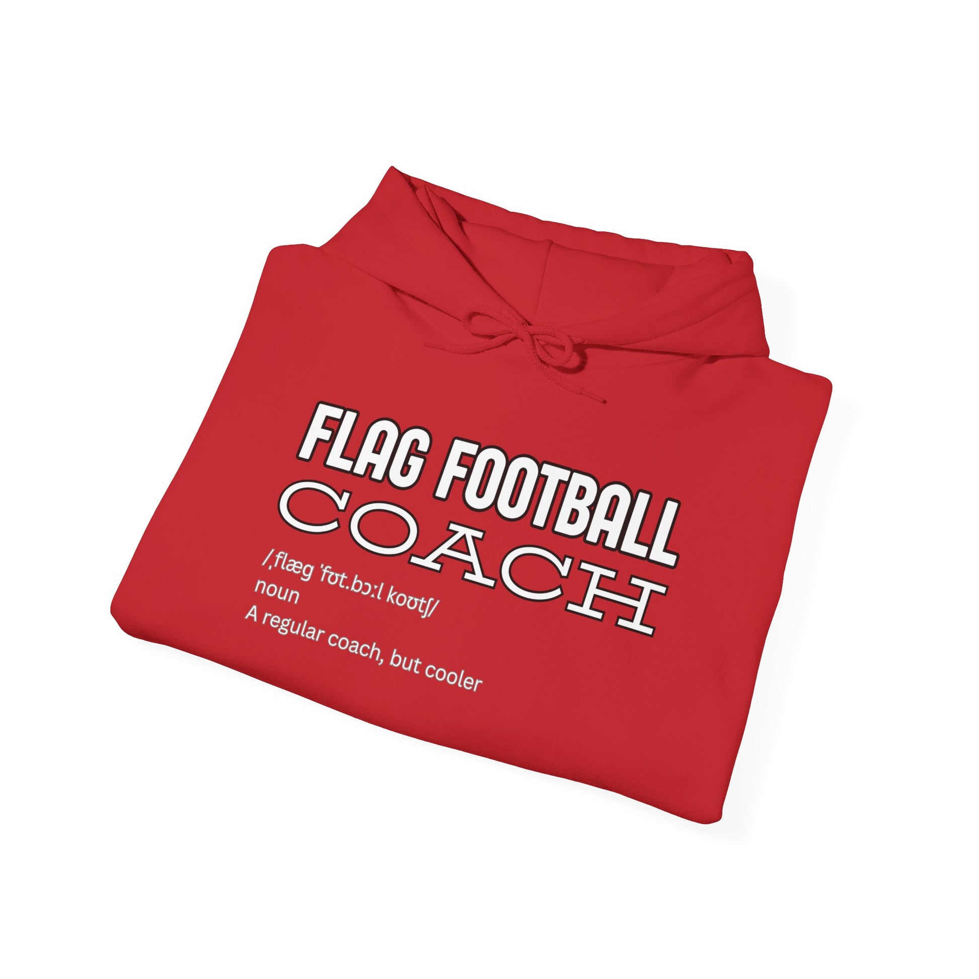 Folded red hoodie showing white "FLAG FOOTBALL COACH /flag football coach/ noun: A regular coach, but cooler" print