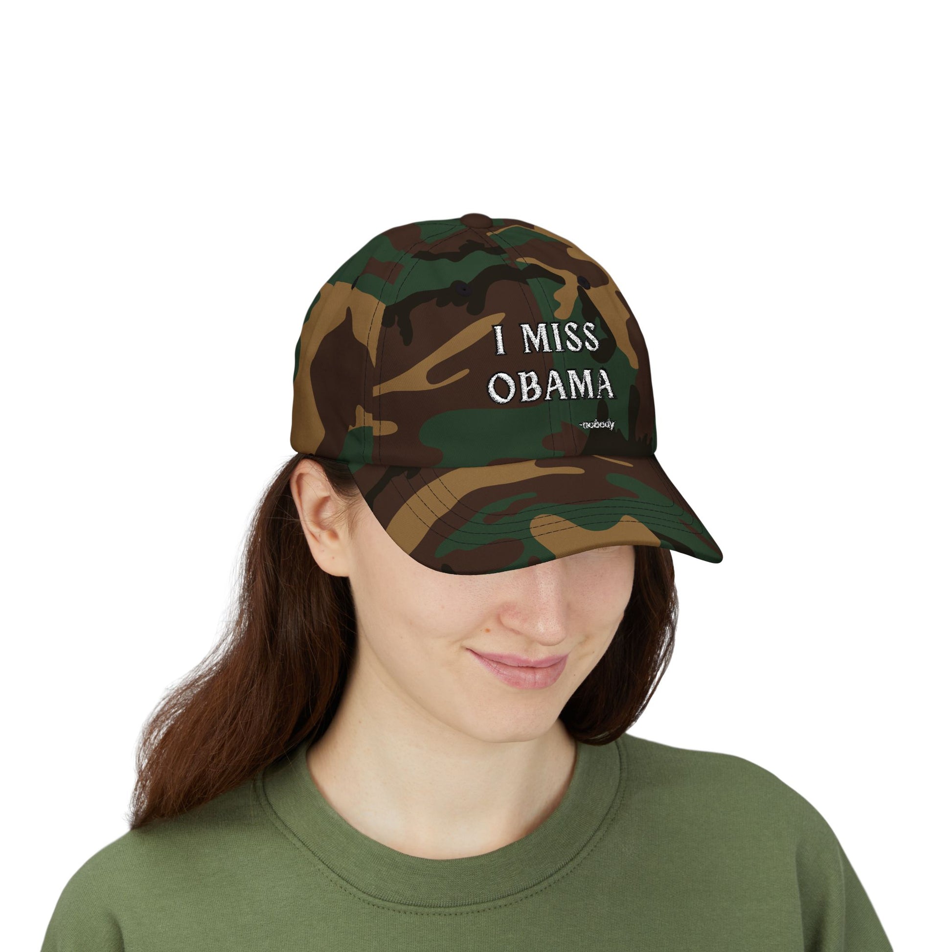 Camouflage dad hat front view on smiling woman model, white "I MISS OBAMA -nobody" embroidery sparking sly vibes