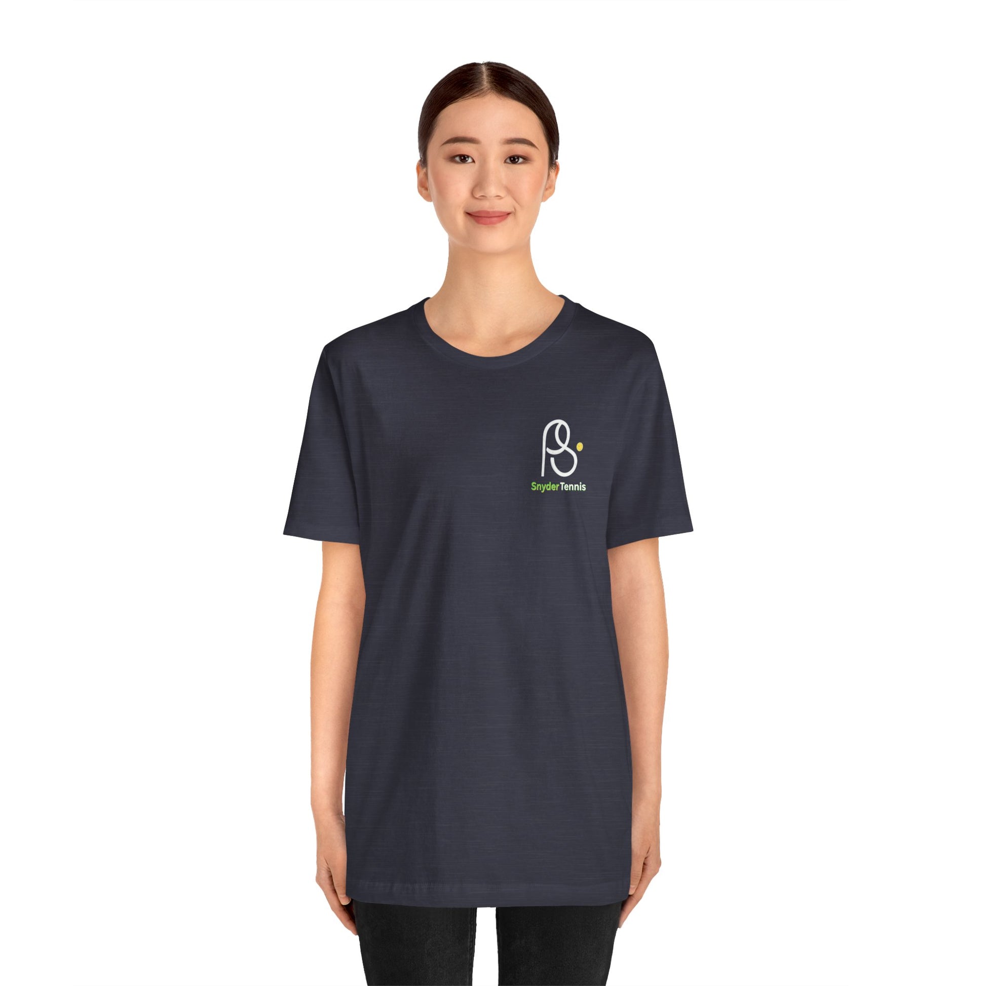 Smiling woman in front view of charcoal gray Coach Pete Snyder tennis tee, PS logo with green "PS Tennis" on sleeve area