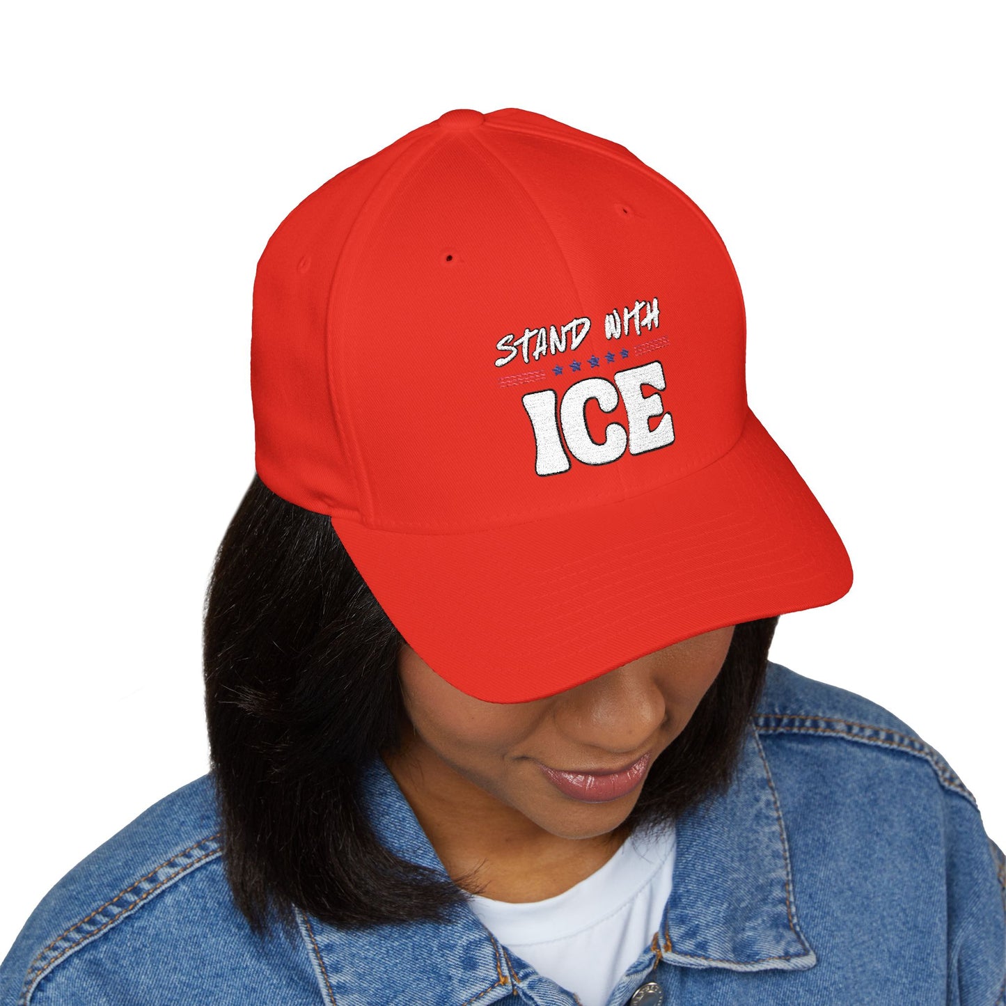 Right side profile of woman in red "Stand With ICE" cap, curved visor and structured fit on point
