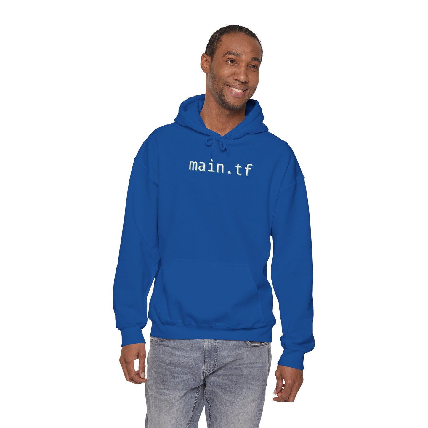 Grinning dude in navy "main.tf" hoodie, front lifestyle shot for DevOps vibes