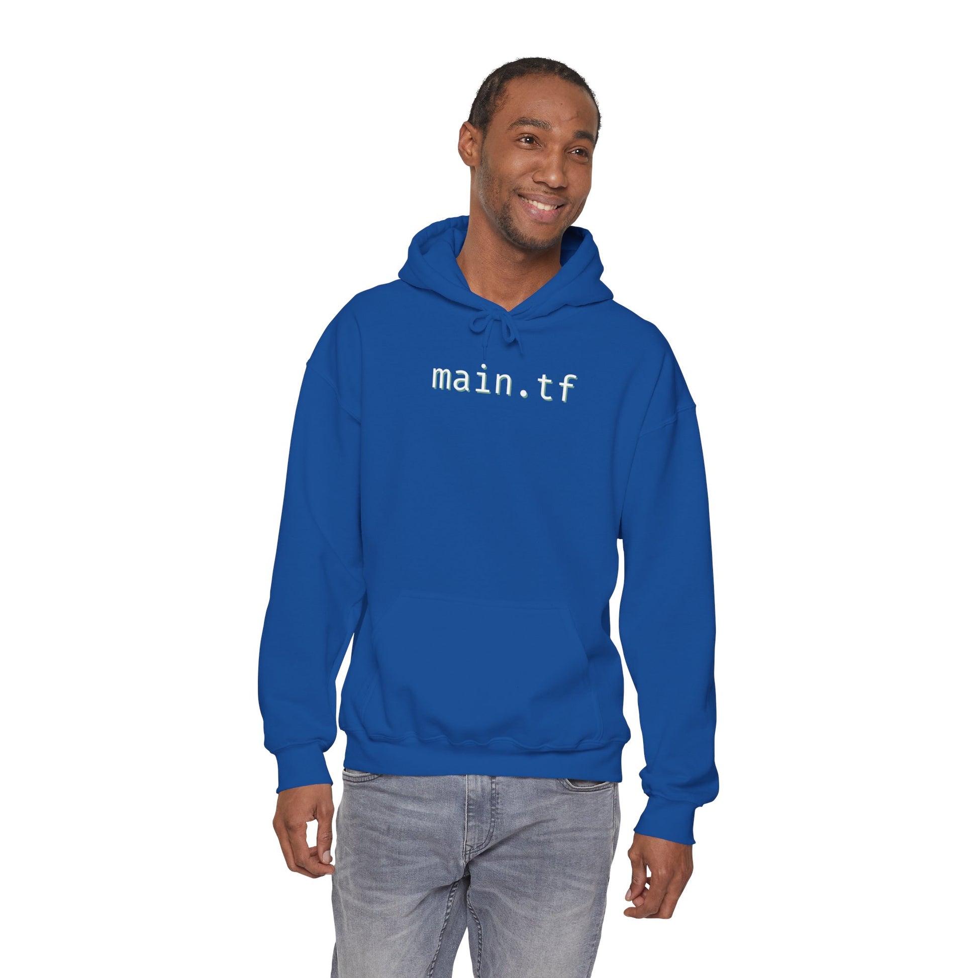 Grinning dude in navy "main.tf" hoodie, front lifestyle shot for DevOps vibes