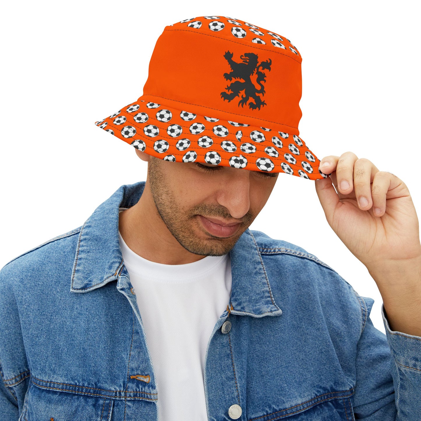 Man models front of orange Dutch lion bucket hat in denim jacket, soccer brim held up for glory