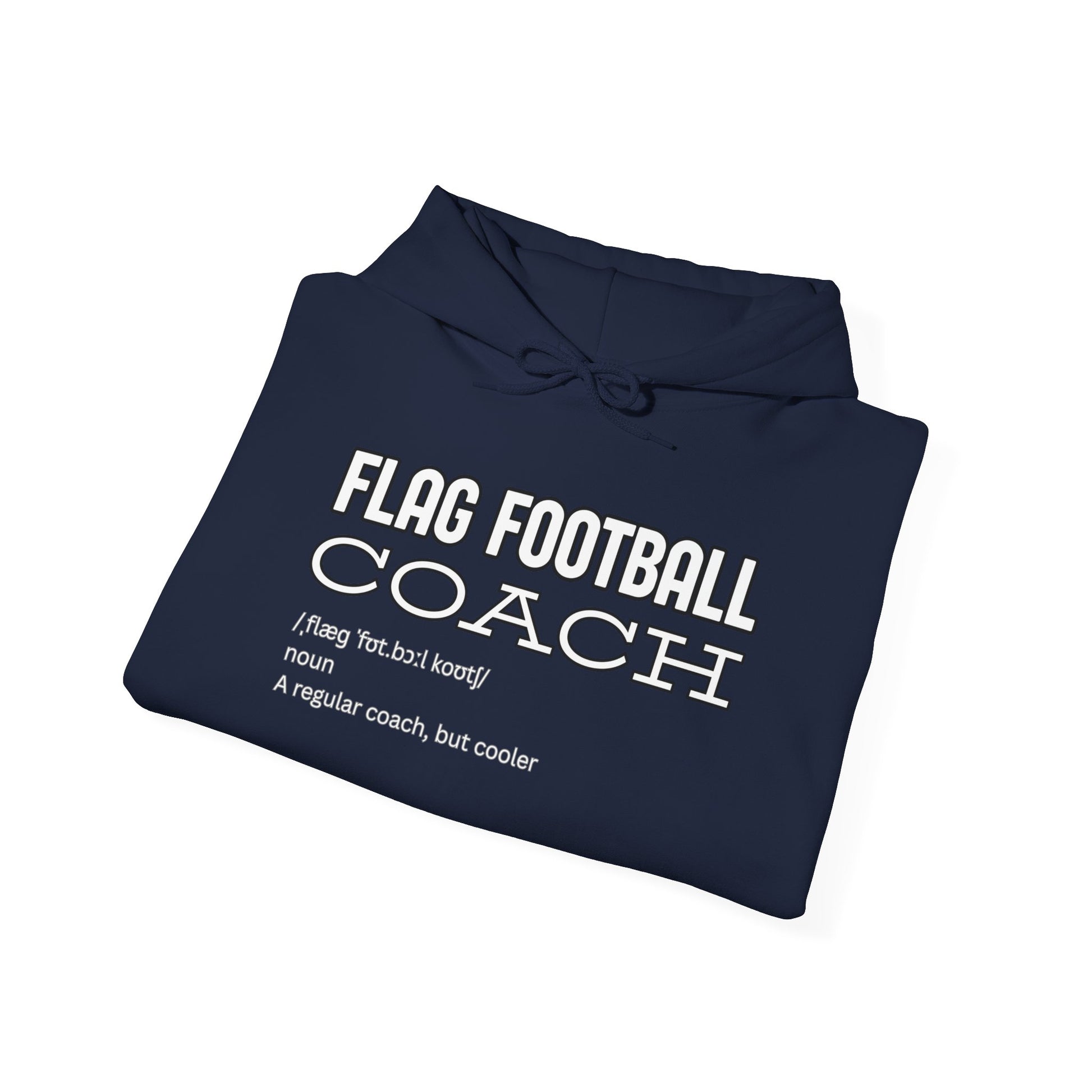 Folded navy blue hoodie displaying front white print: "FLAG FOOTBALL COACH (flag foot coach) noun: A regular coach, but cooler"