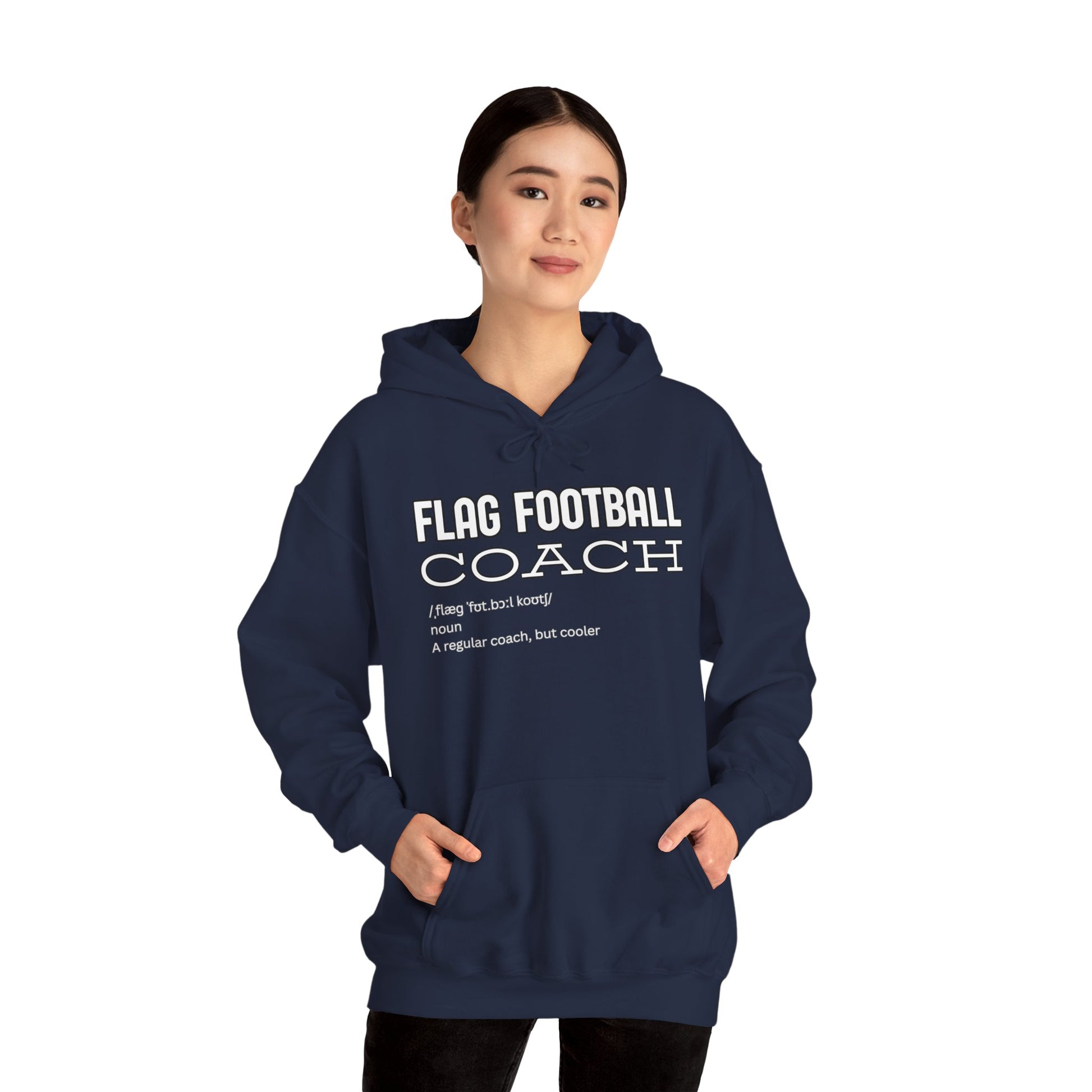 Asian female model front view in navy hoodie with white "Flag Football Coach" print, hands in pockets