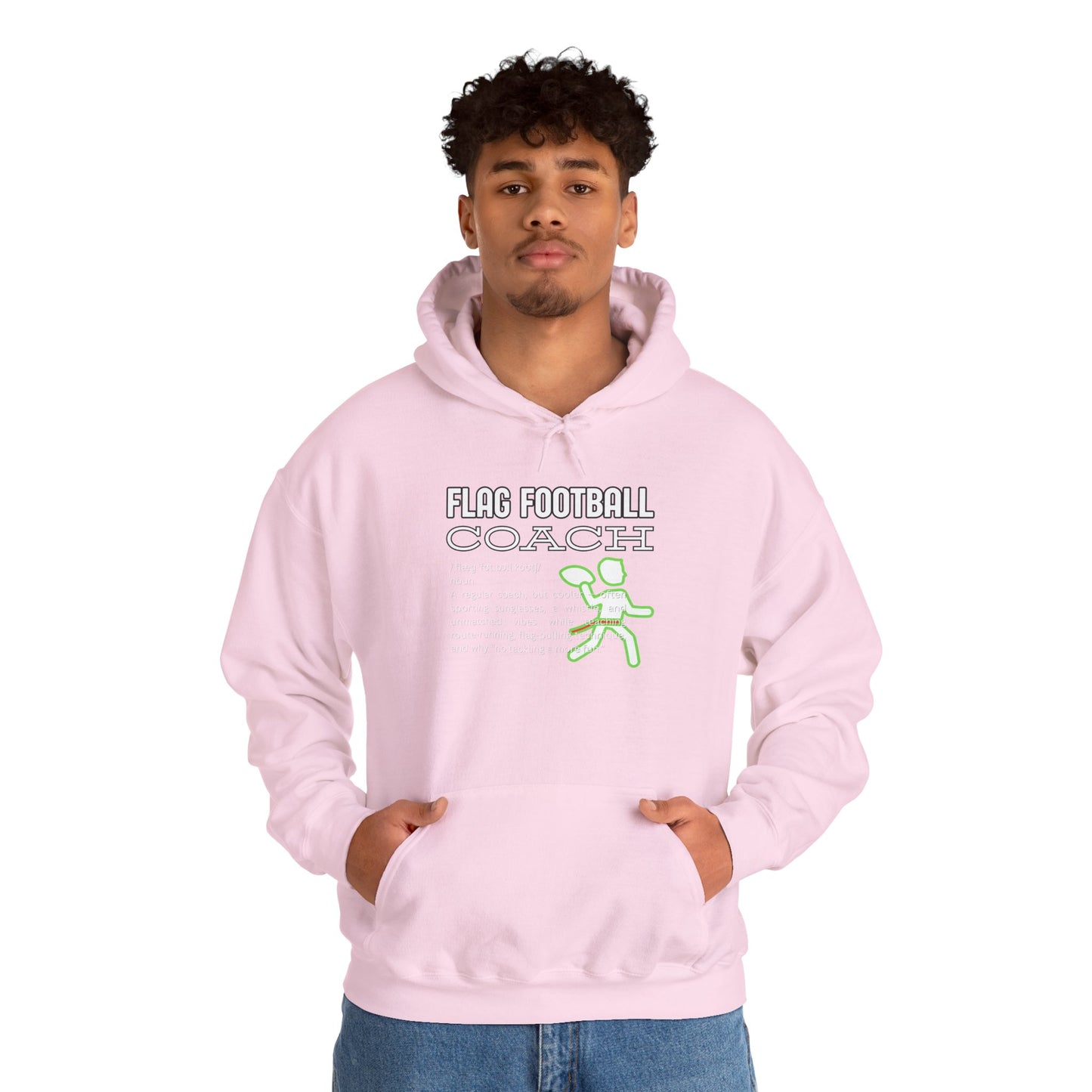 Curly-haired guy models light pink hoodie front, Flag Football Coach design glowing neon