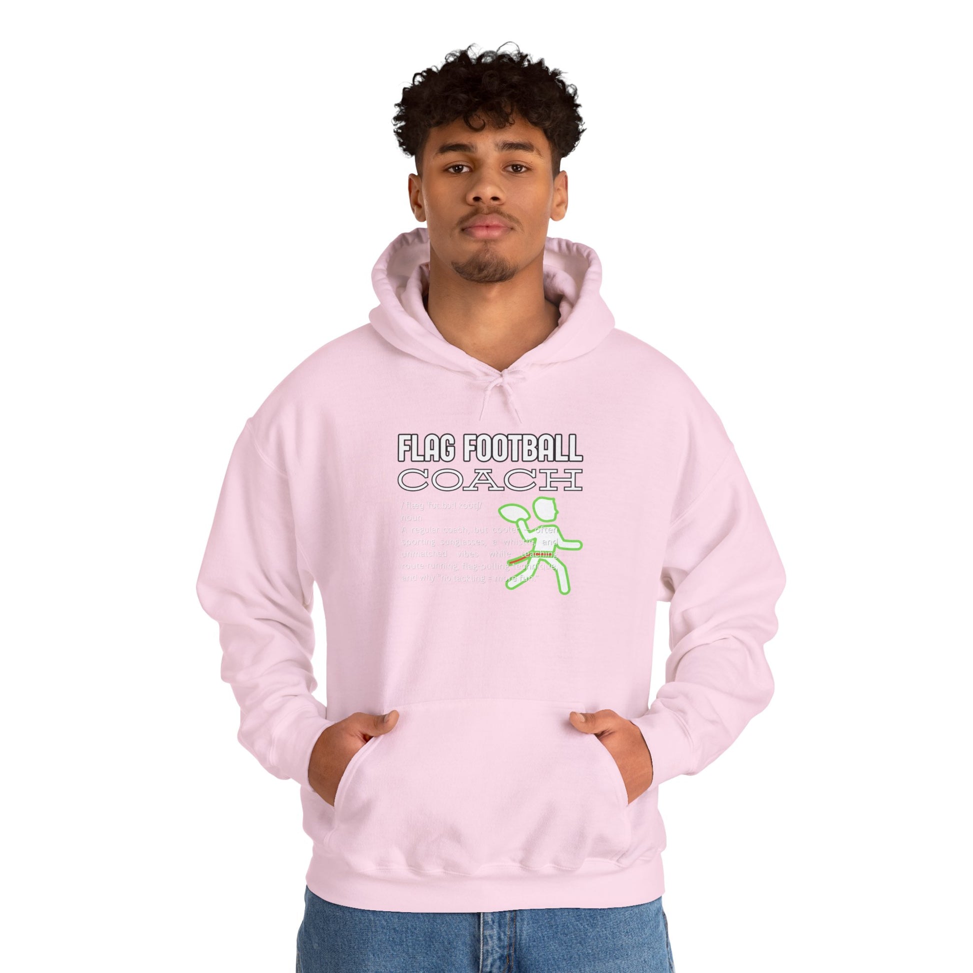 Curly-haired guy models light pink hoodie front, Flag Football Coach design glowing neon