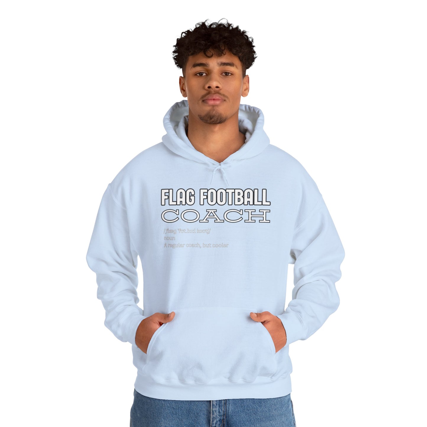 Curly-haired male model in light blue Flag Football Coach hoodie front, playful white print popping