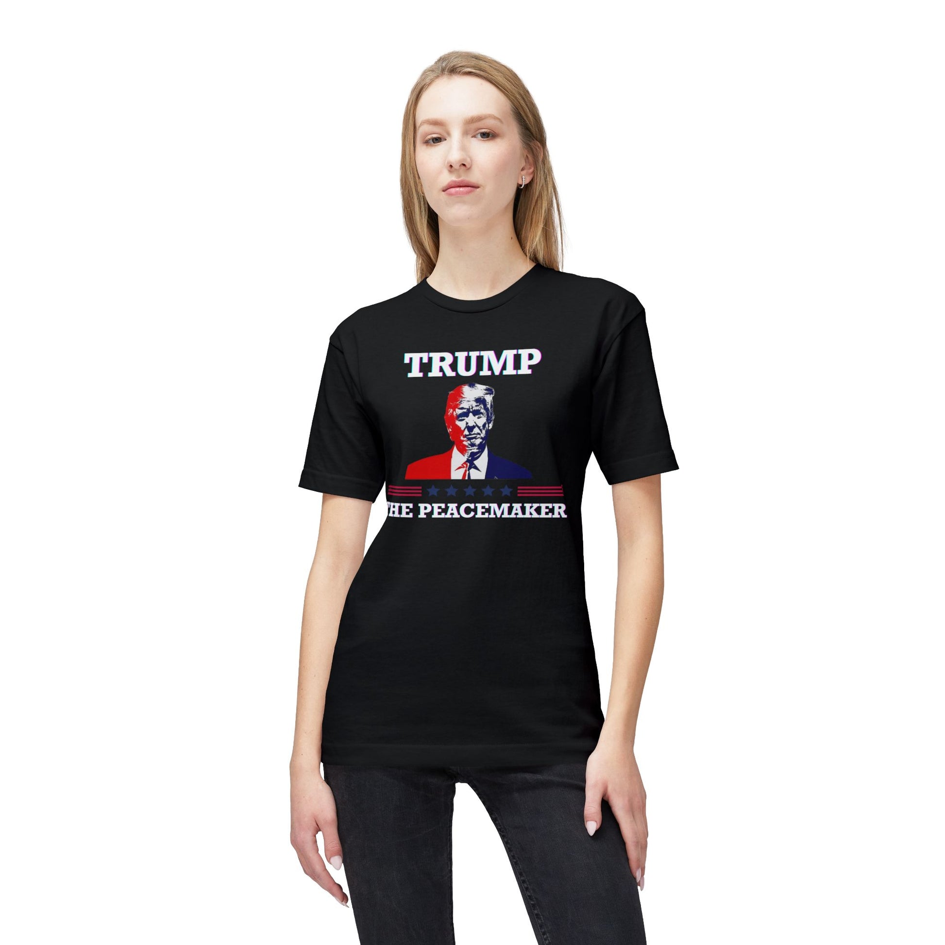 Blonde model fronts black tee with white "TRUMP", patriotic Trump graphic, "HE ★ PEACEMAKER" print — plot twist activated