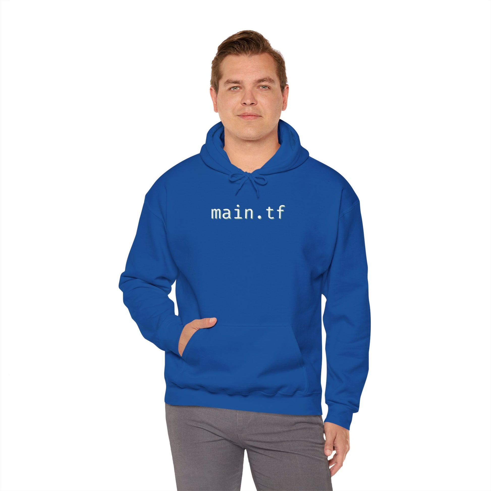 Front view of smiling guy in navy blue pullover hoodie with white "main.tf" chest print – SRE flex