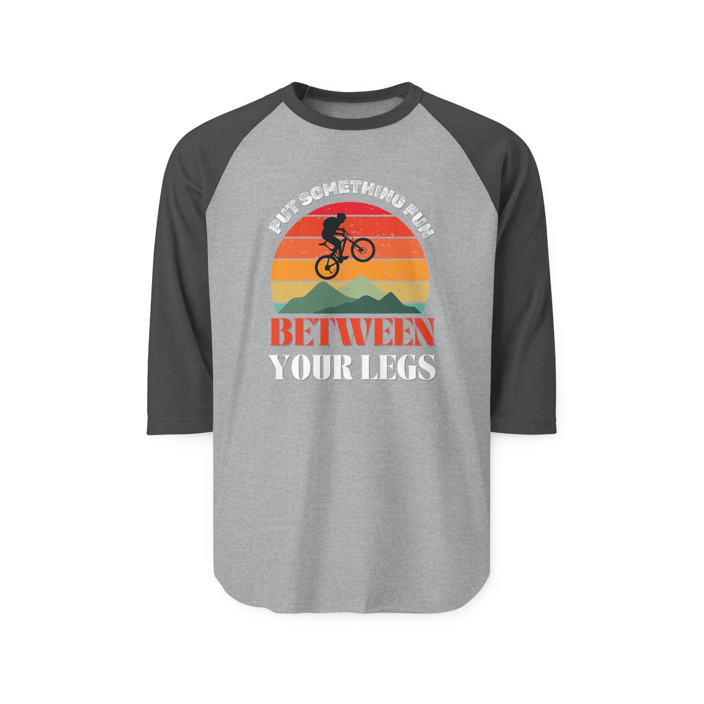 Front view of heather grey raglan shirt with black sleeves, "Put something fun between your legs" print and sunset MTB graphic