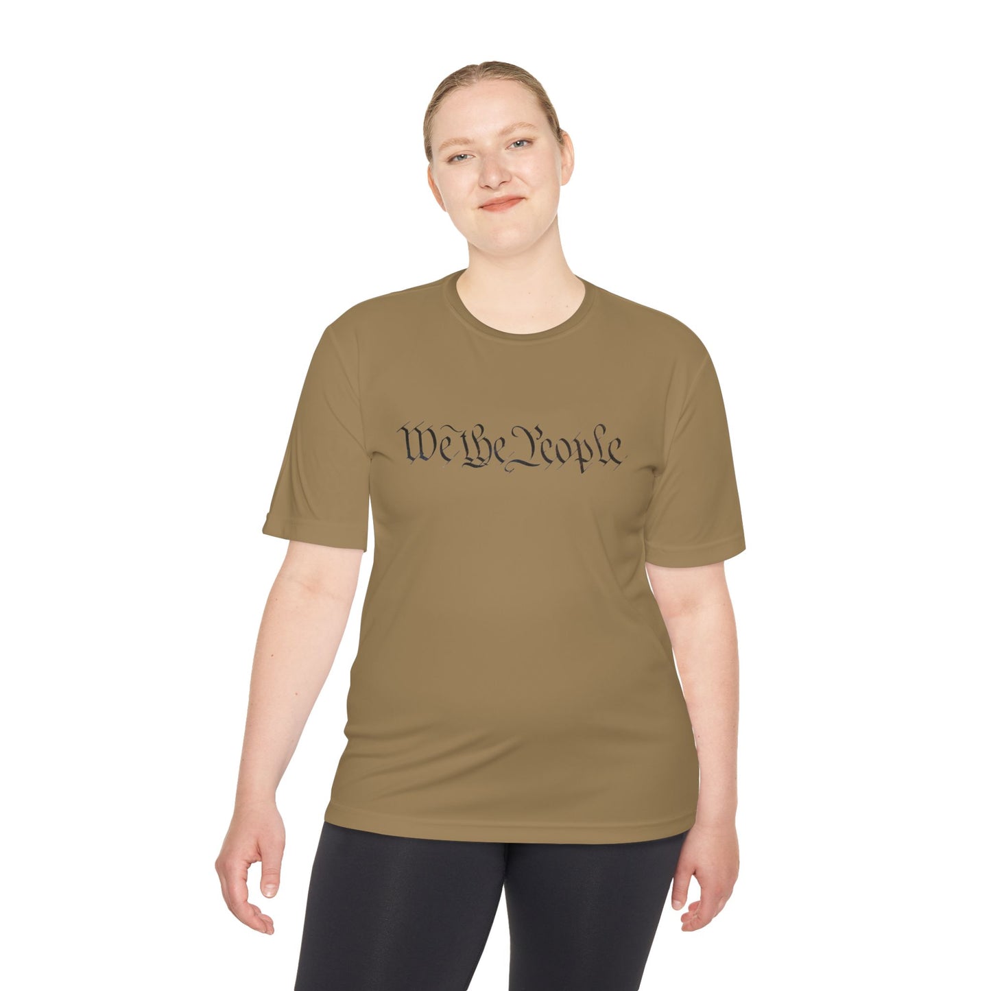 Woman in tan tee flashing "We the People" script up front, black letters with sneaky QR