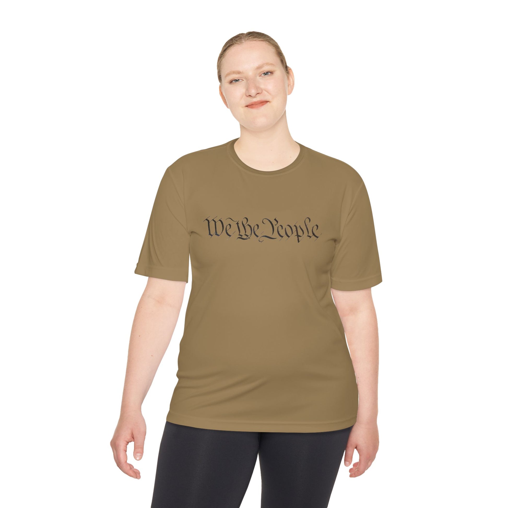 Woman in tan tee flashing "We the People" script up front, black letters with sneaky QR