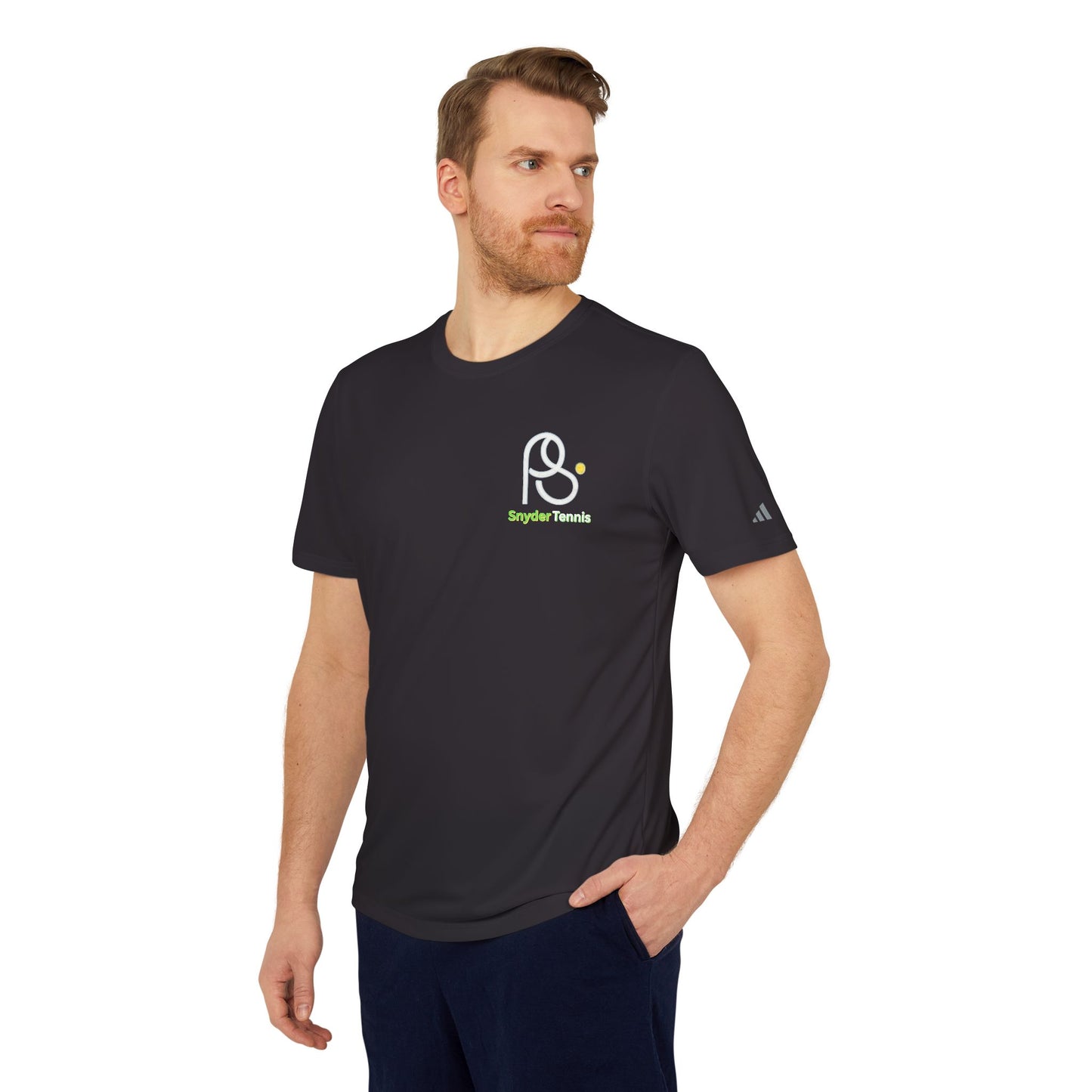 Bearded dude in black adidas performance tee, three-quarter front with PB Tennis logo, hands in pockets