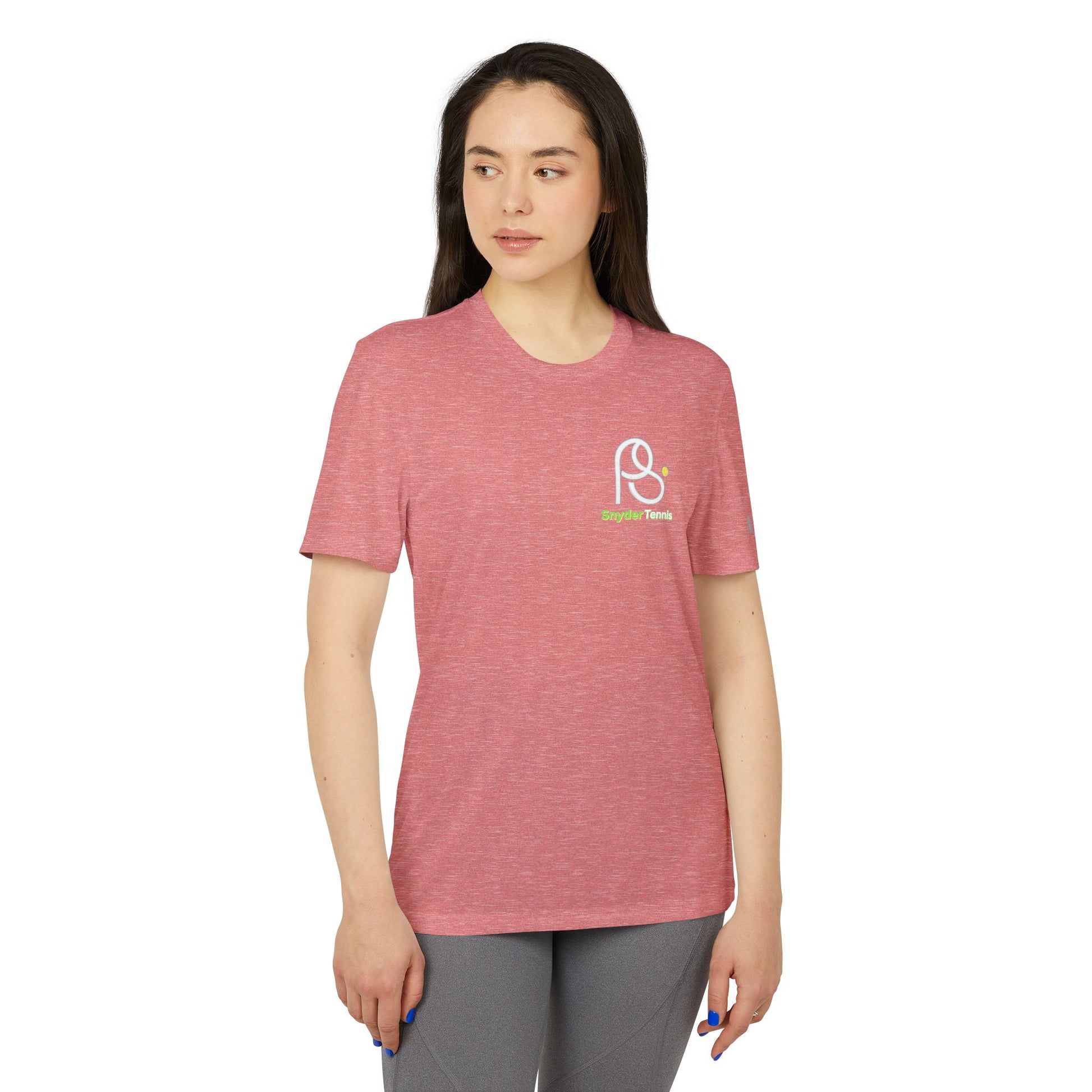 Female model in heather red short-sleeve tee, front left chest white "P8" logo with green underline, relaxed athletic pose in gray leggings