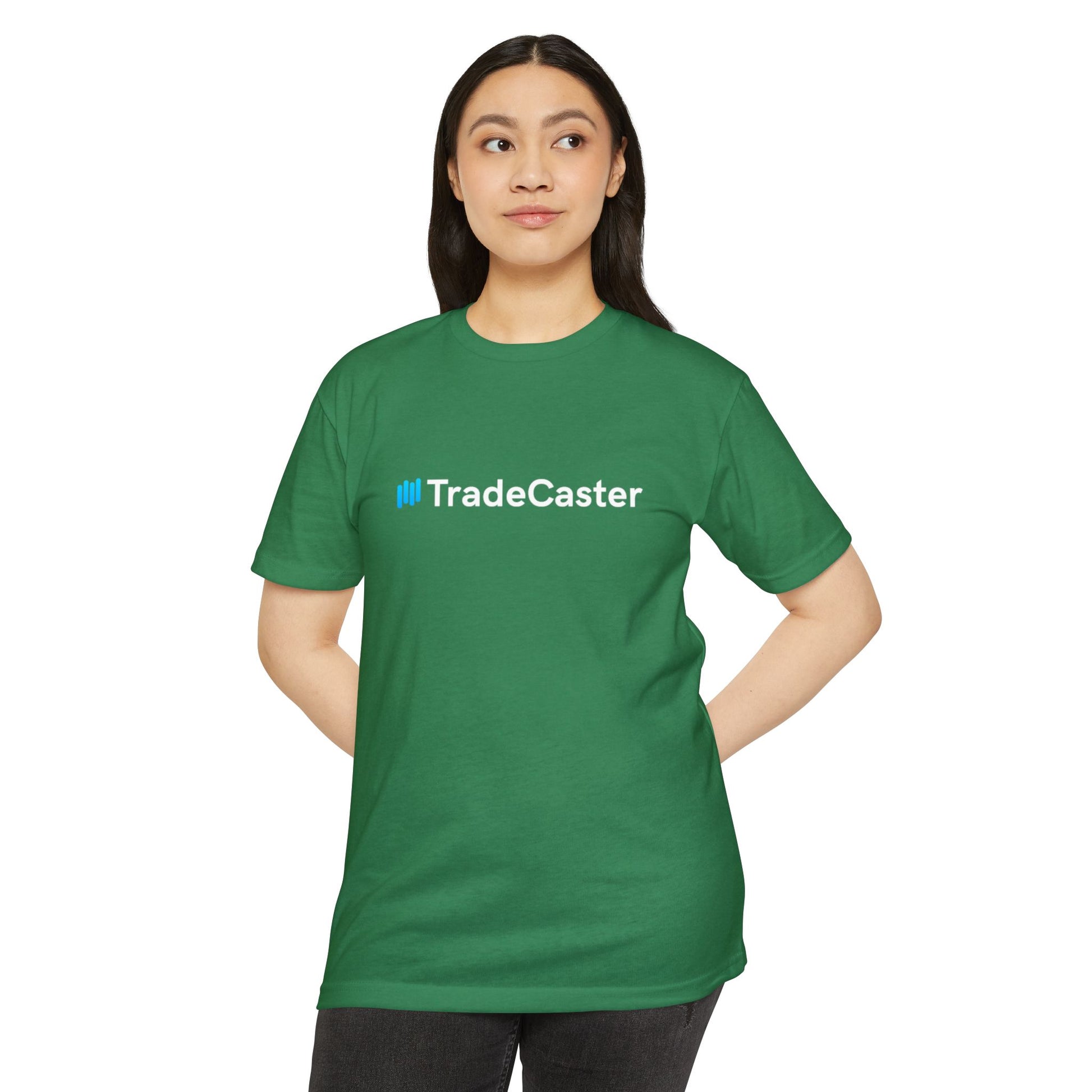 Female model front-facing in green TradeCaster t-shirt, bold blue-and-white logo centered