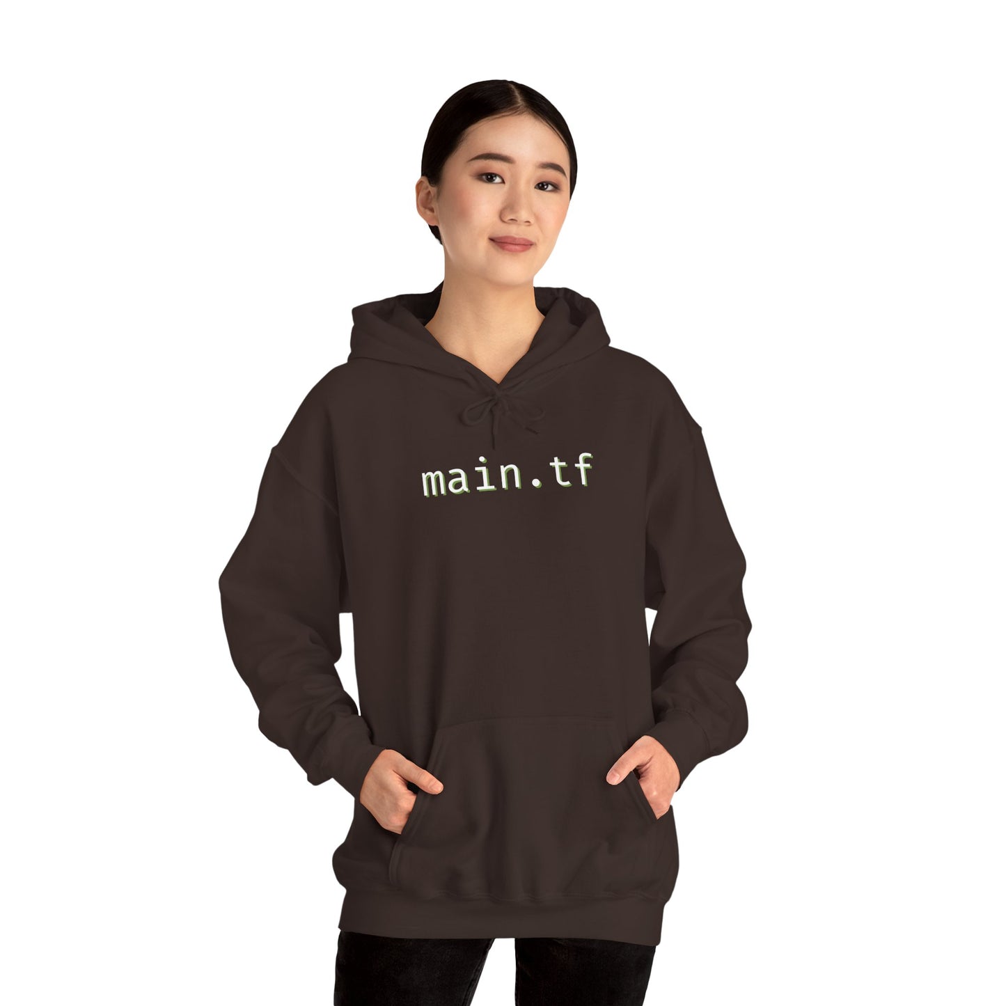 Curly-haired male model fronts dark maroon hoodie with white "main.tf" print