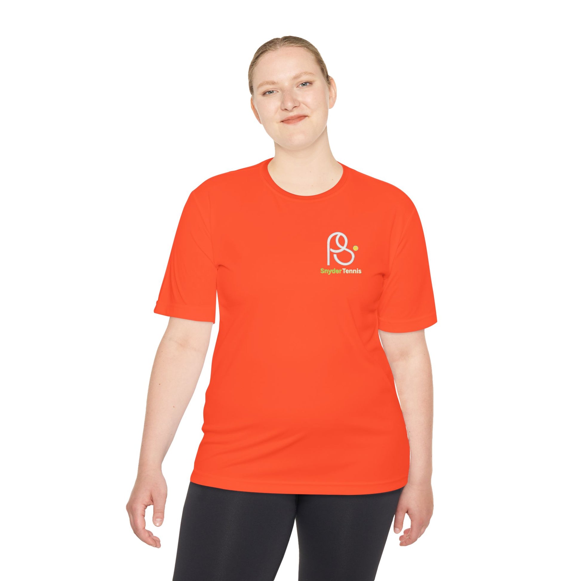 Female model in orange tee, front view highlighting white "P S" logo and green "Brighton Tennis"