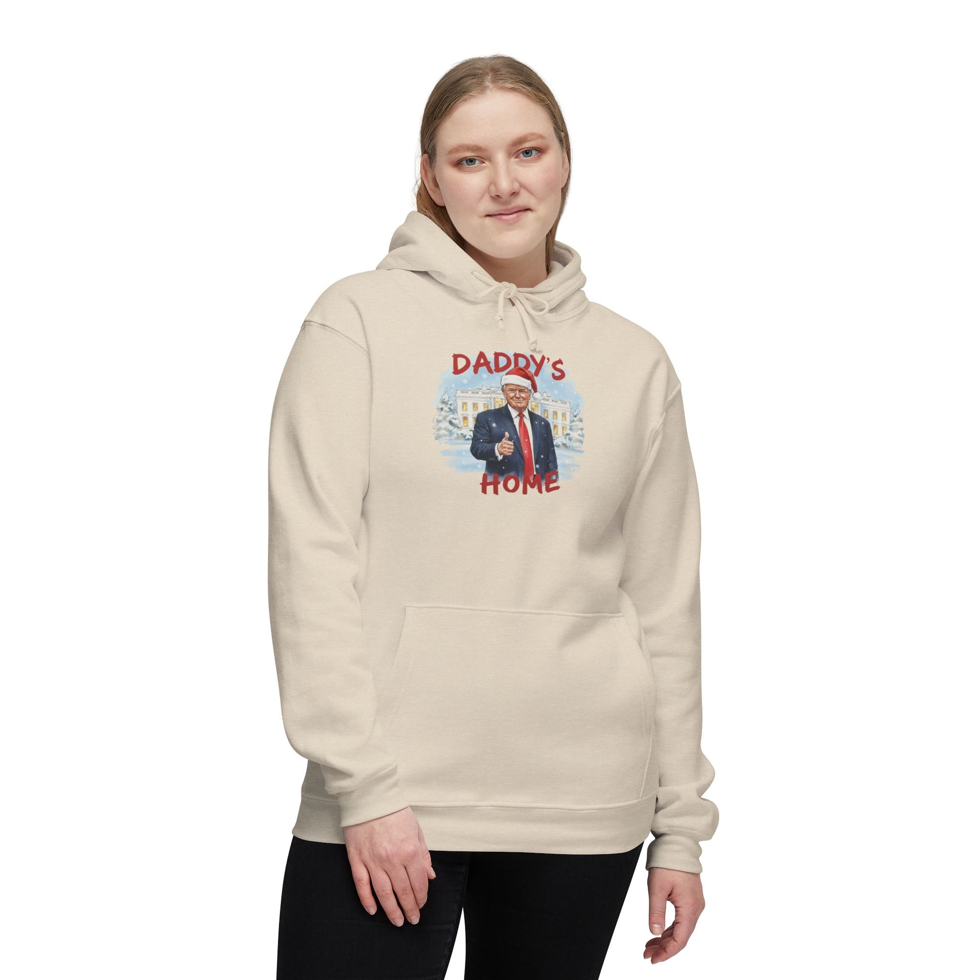 Woman wearing cream "Daddy's Home" front hoodie with Trump in Santa hat and winter White House