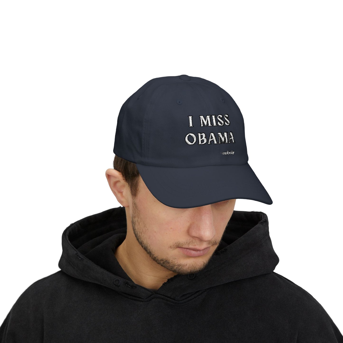 Man model front view in black hoodie, navy "I MISS OBAMA -nobody" embroidered dad hat on point