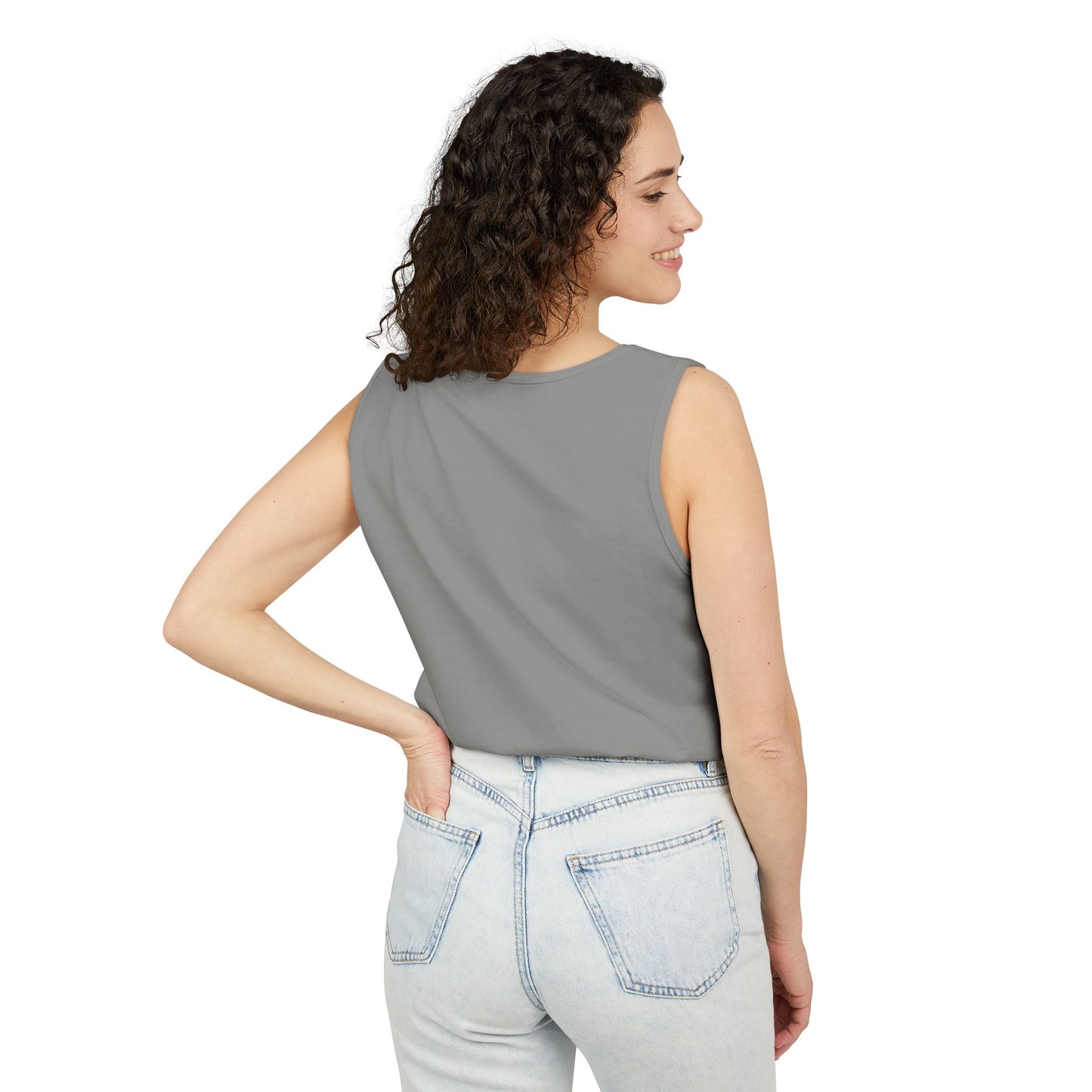 Side profile of woman wearing plain gray tank top with relaxed fit over jeans