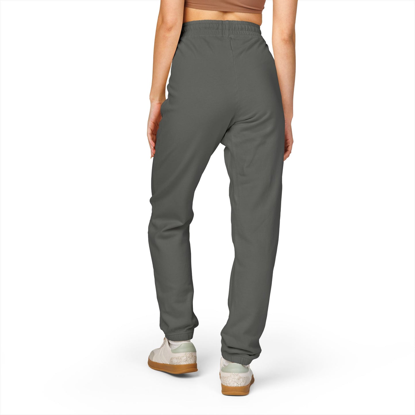 Model back view rocking charcoal gray Zeta joggers, drawstring waist, white chunky sneakers — pure lounge