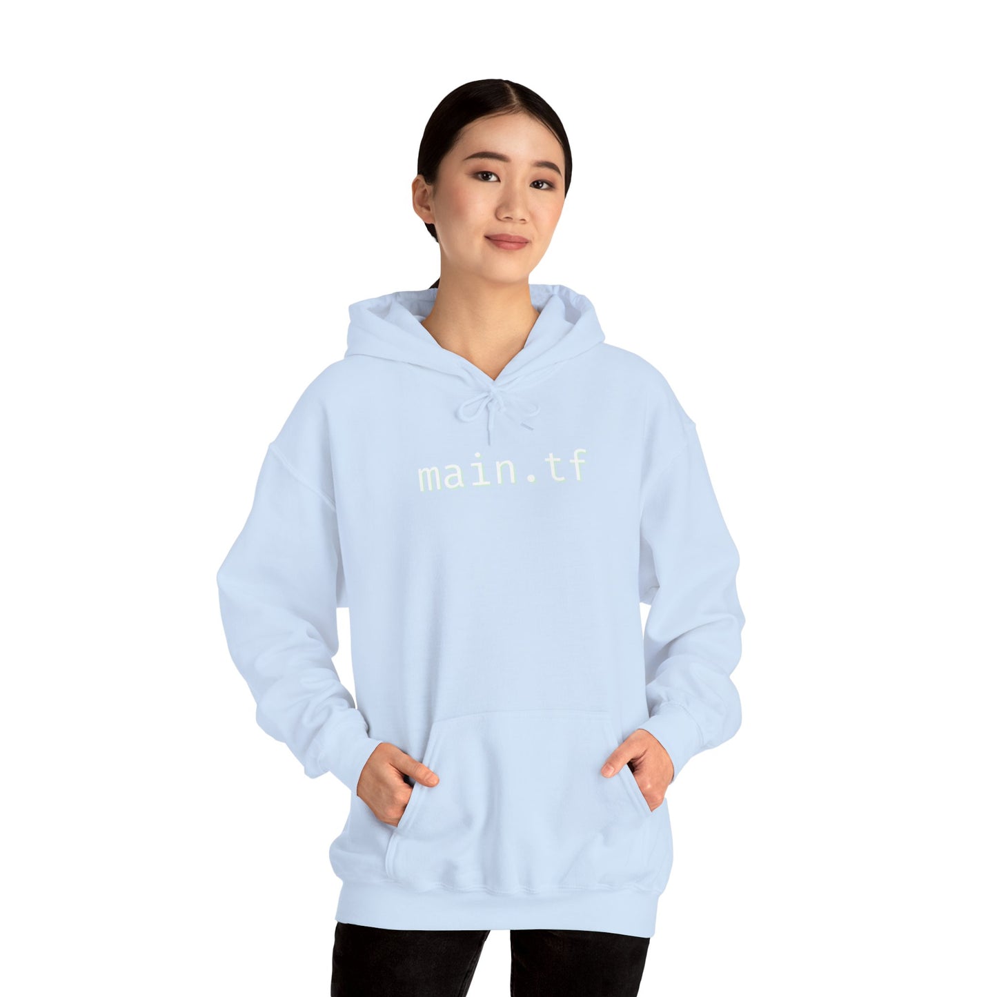Flat lay light blue hoodie folded open, crisp white "main.tf" print stealing the show