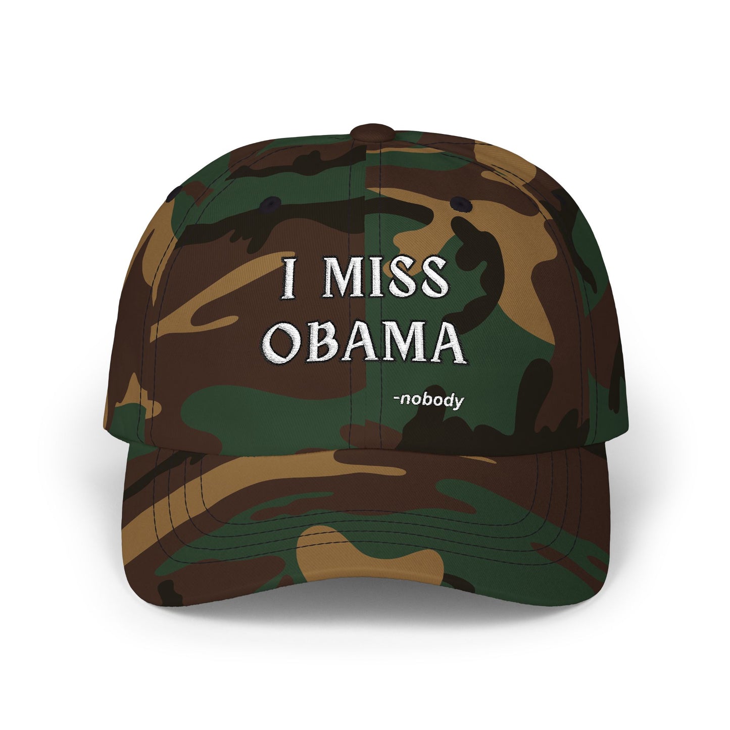 Front view of camouflage dad hat with white "I MISS OBAMA -nobody" embroidery popping