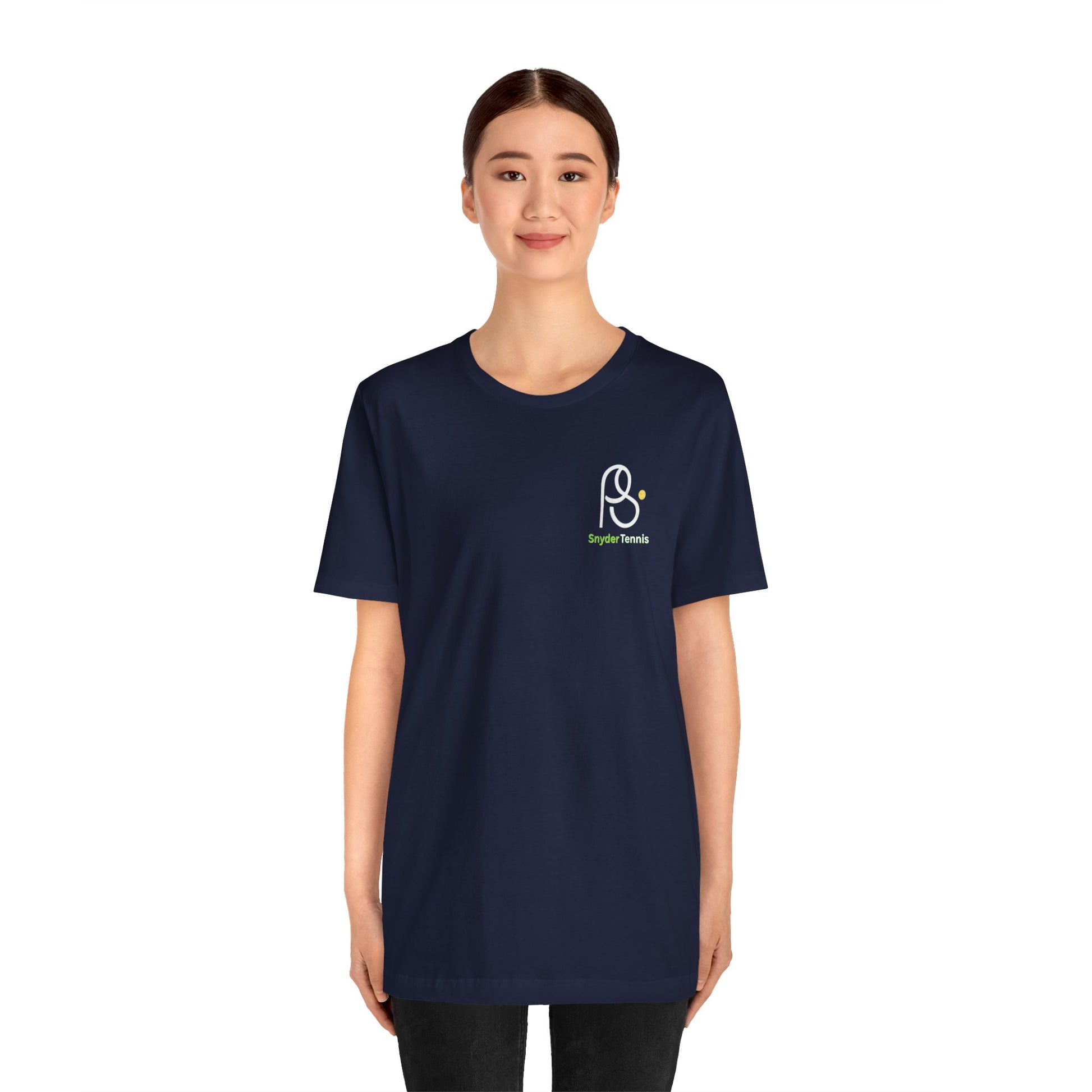 Female model in navy tee front pose, white "PⓈ" and green "Snyder Tennis" logo on chest