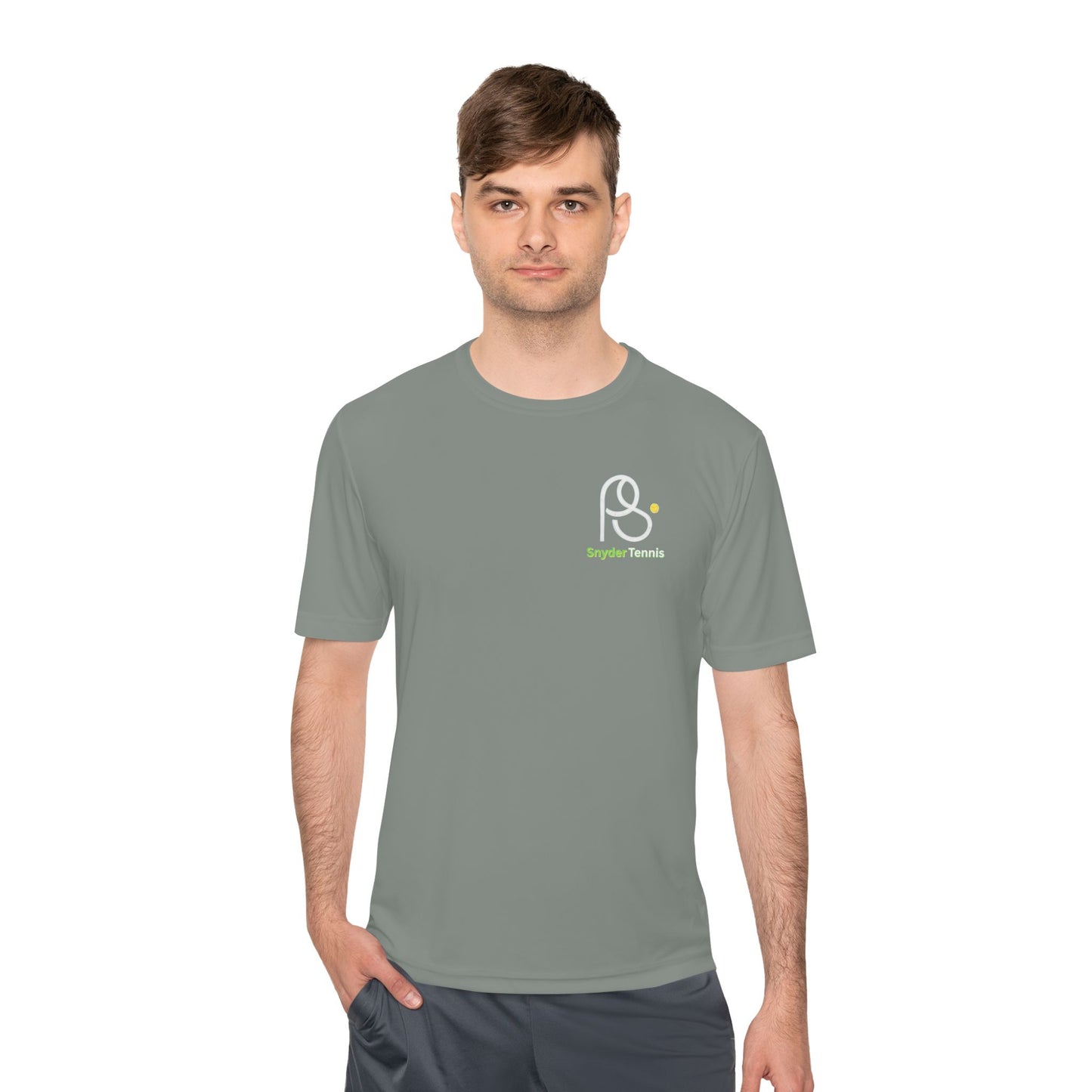 Model smashing serves in grey moisture-wicking Coach Pete Snyder tee, white PS Bryant Tennis logo on chest