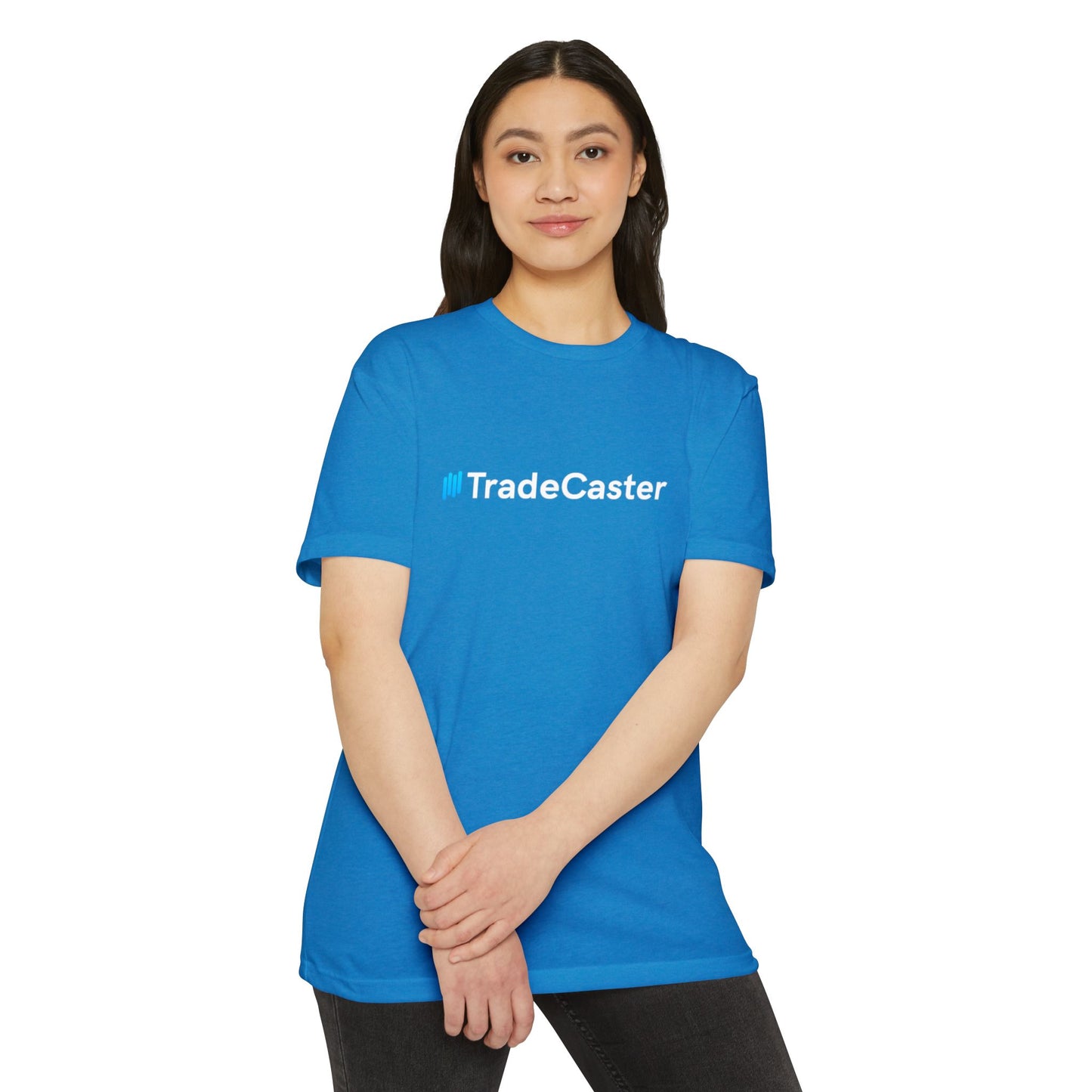 Smiling woman models front of royal blue TradeCaster t-shirt, crisp white logo centered
