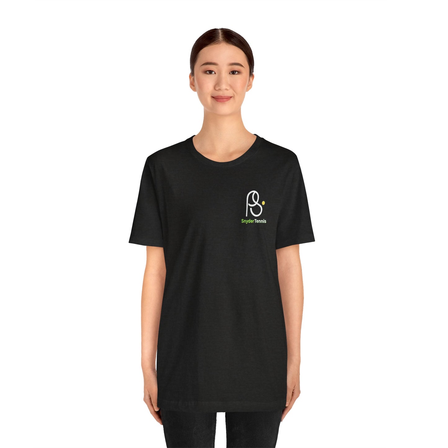 Smiling woman model in black Coach Pete Snyder tennis tee, white PS Harrison Tennis logo on left chest