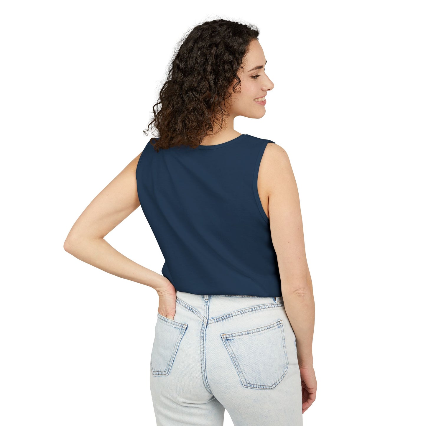 Side view of woman in plain navy blue tank top paired with light jeans