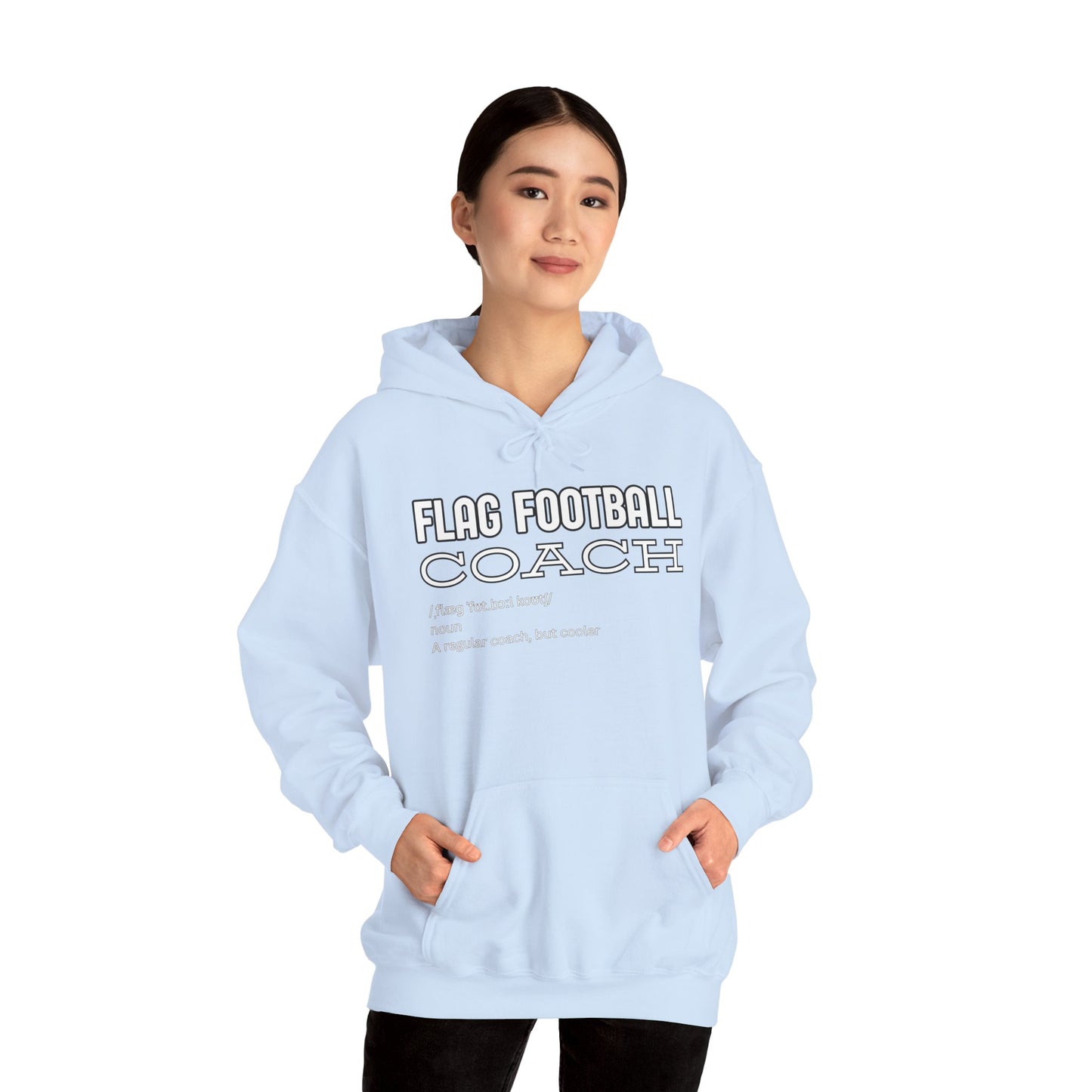 Female model in light blue hoodie, front view with white "FLAG FOOTBALL COACH cooler than regular" text
